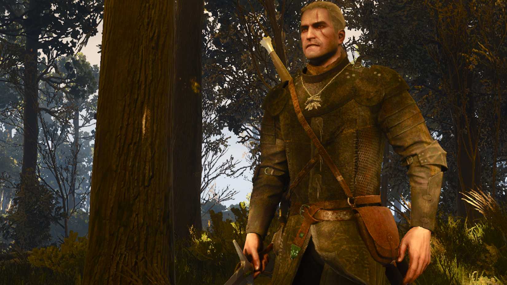 Geralt in the woods wearing modded armor inspired by The Hexer in The Witcher 3 Remastered.