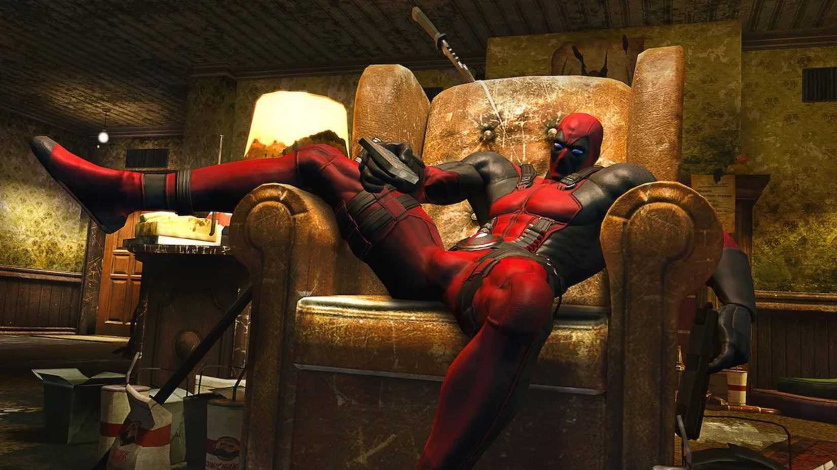 deadpool lounging in an armchair.