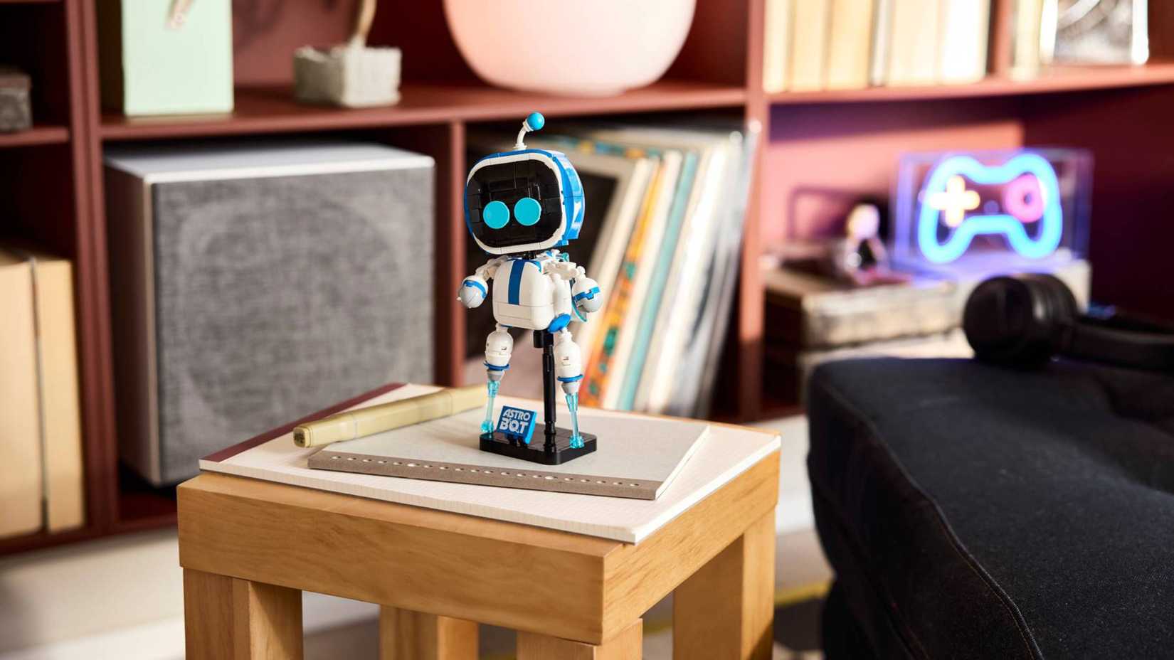 lego astro bot standing on a table.