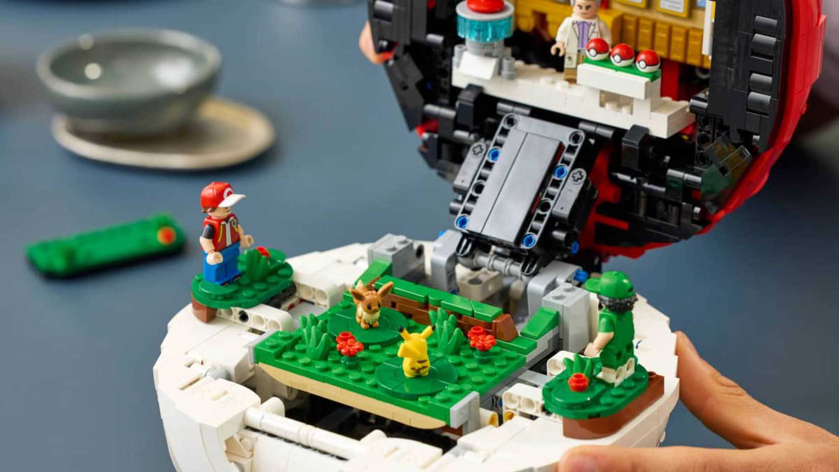 trainers battling inside pokemon's lego poke ball.