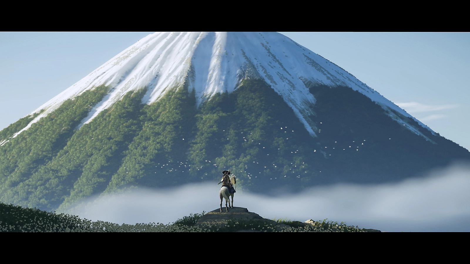 Personagem explorando uma área montanhosa em Ghost of Yotei.