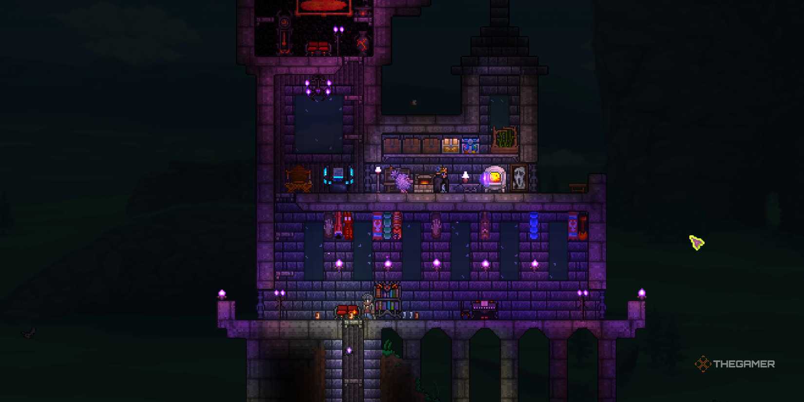 A player standing at his Terraria base.