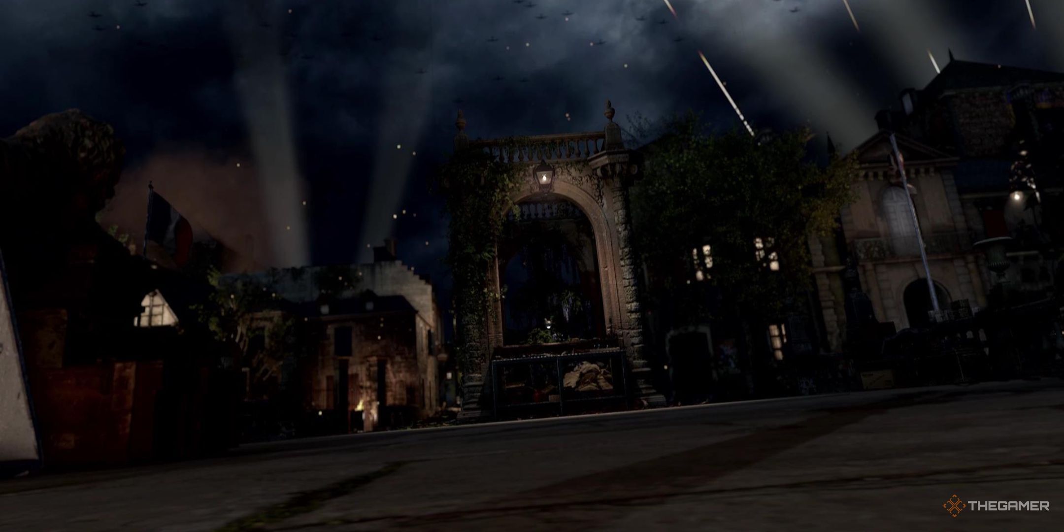 Warplanes blanket the night sky as a lantern lights a pleasant area in Sniper Elite: Resistance.