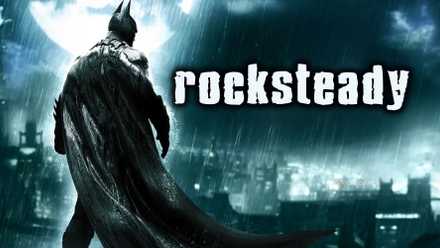 Batman overlooking Gotham City with the Rocksteady logo on the right side of the screen.
