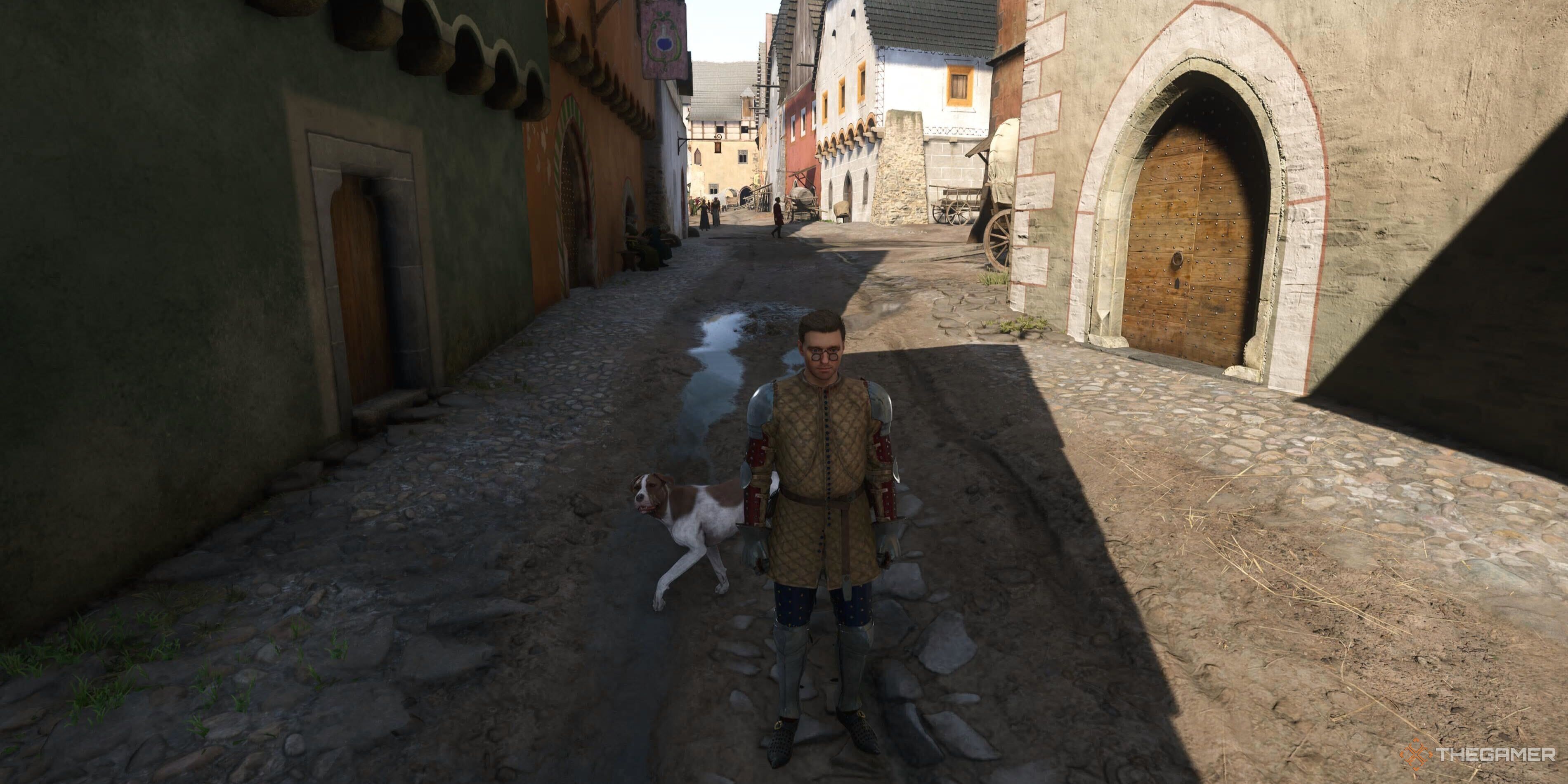 Henry and mutt on a street in Kingdom Come: Deliverance 2.