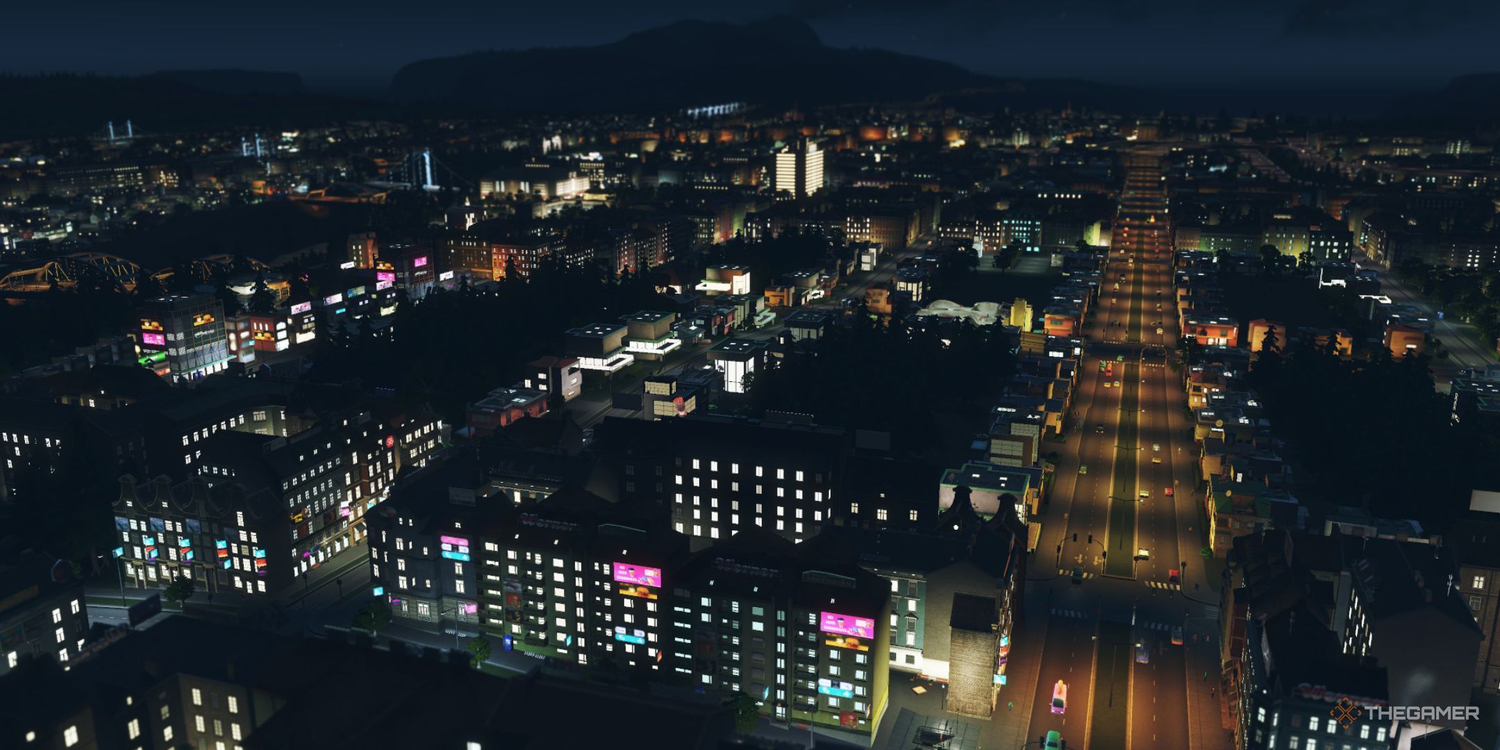 A city is shown at night. it is filled with neon light.