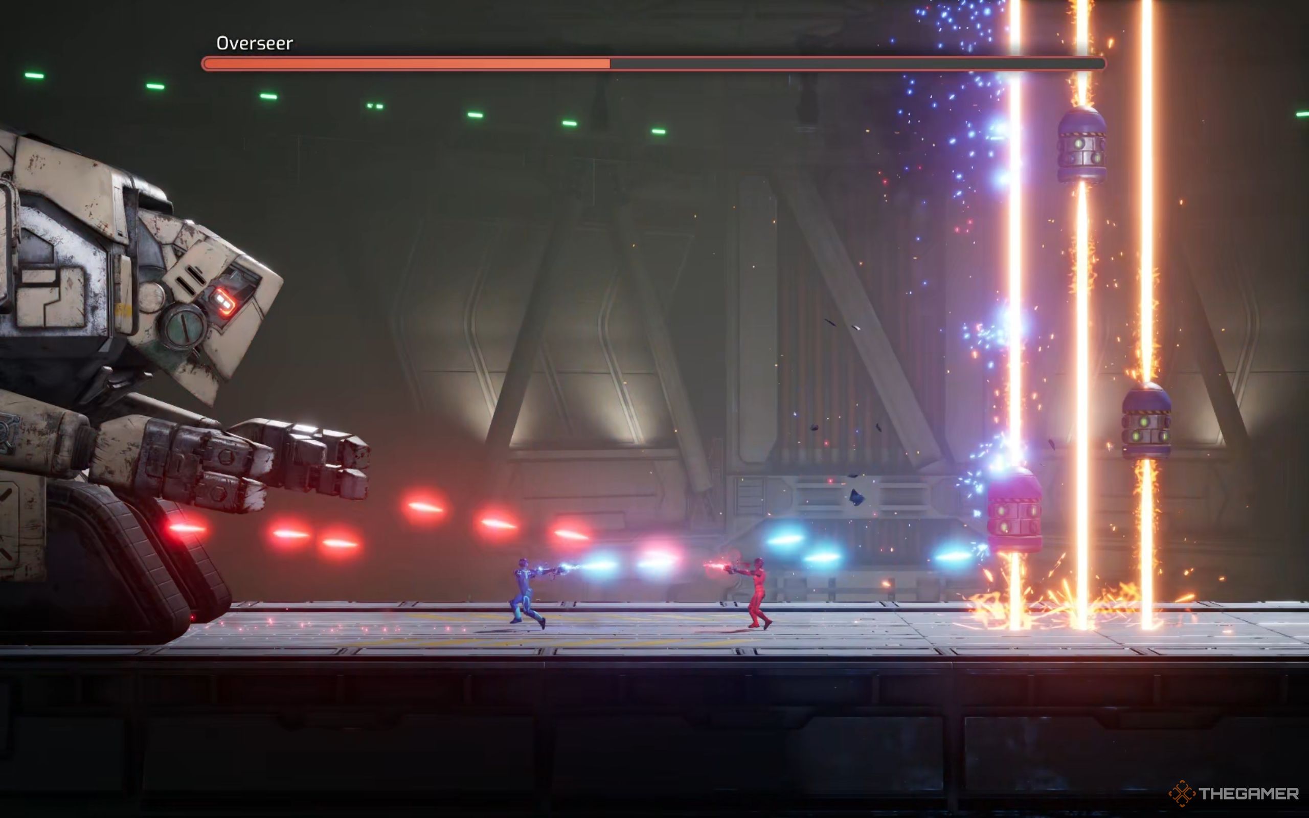 Mio shoots the Overseer, while Zoe shoots the blue missiles to shut off the lasers.