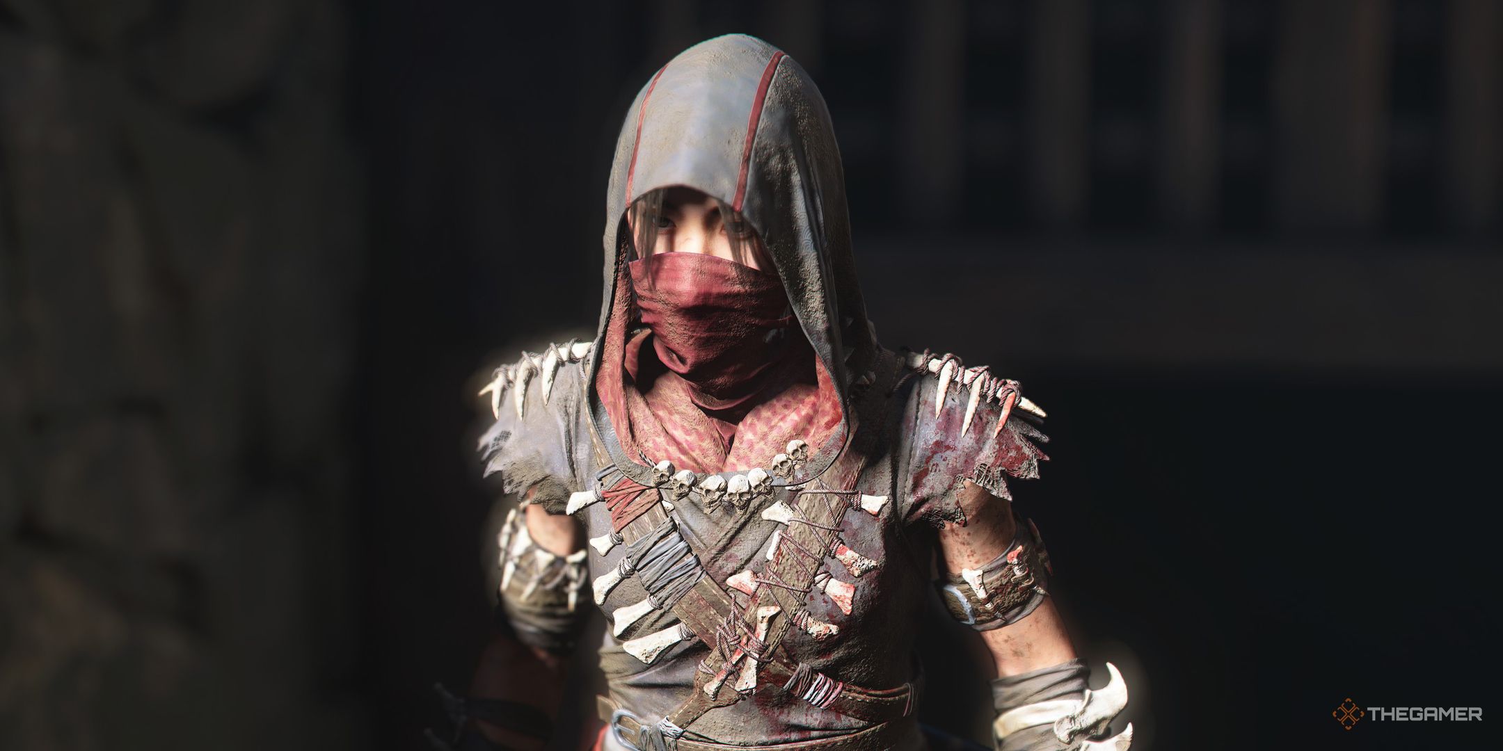 Assassin's Creed Shadows screenshot of Naoe walking past a castle gate.