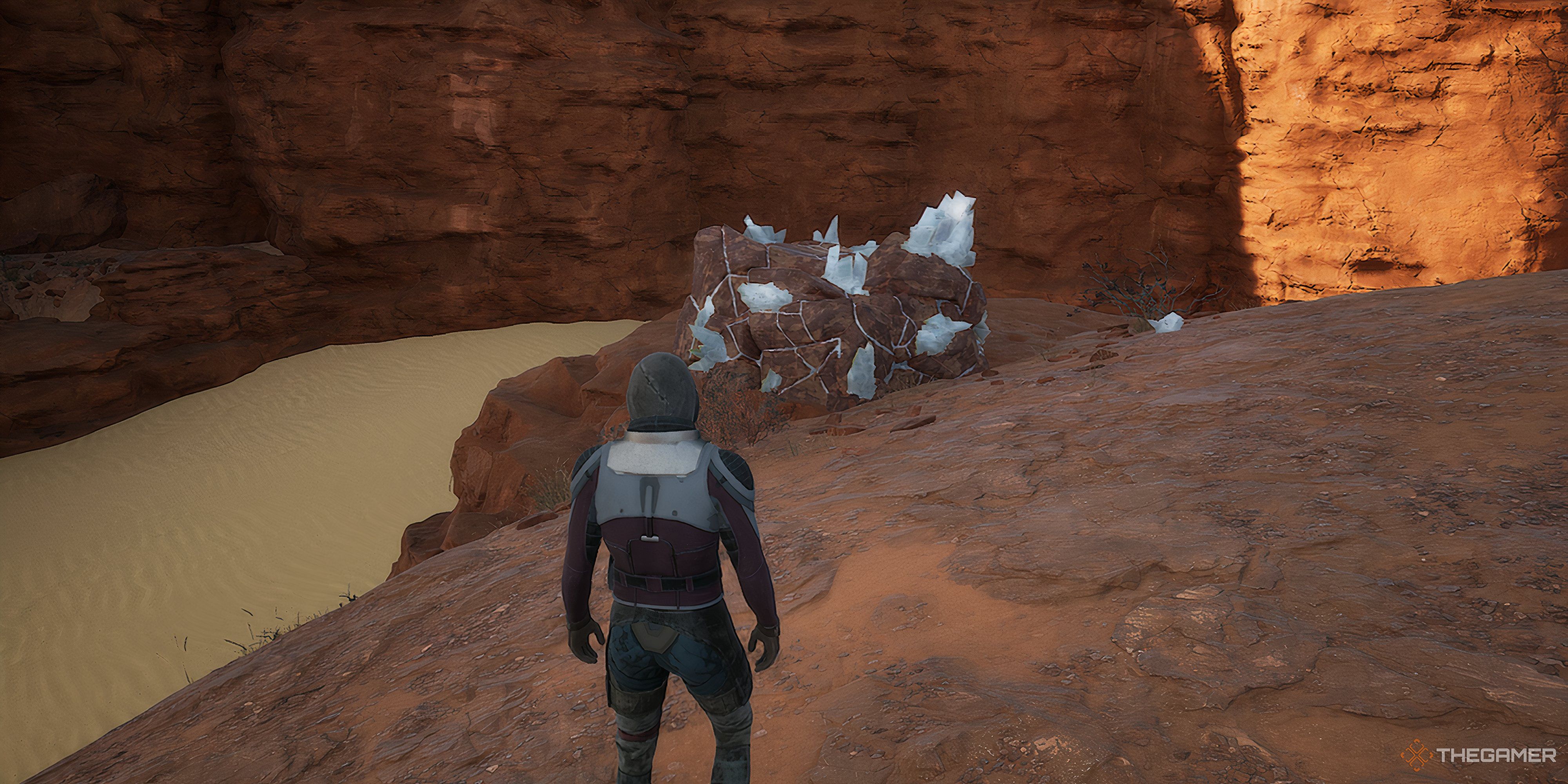 Character looking at the Carbon stone pile in Dune: Awakening.