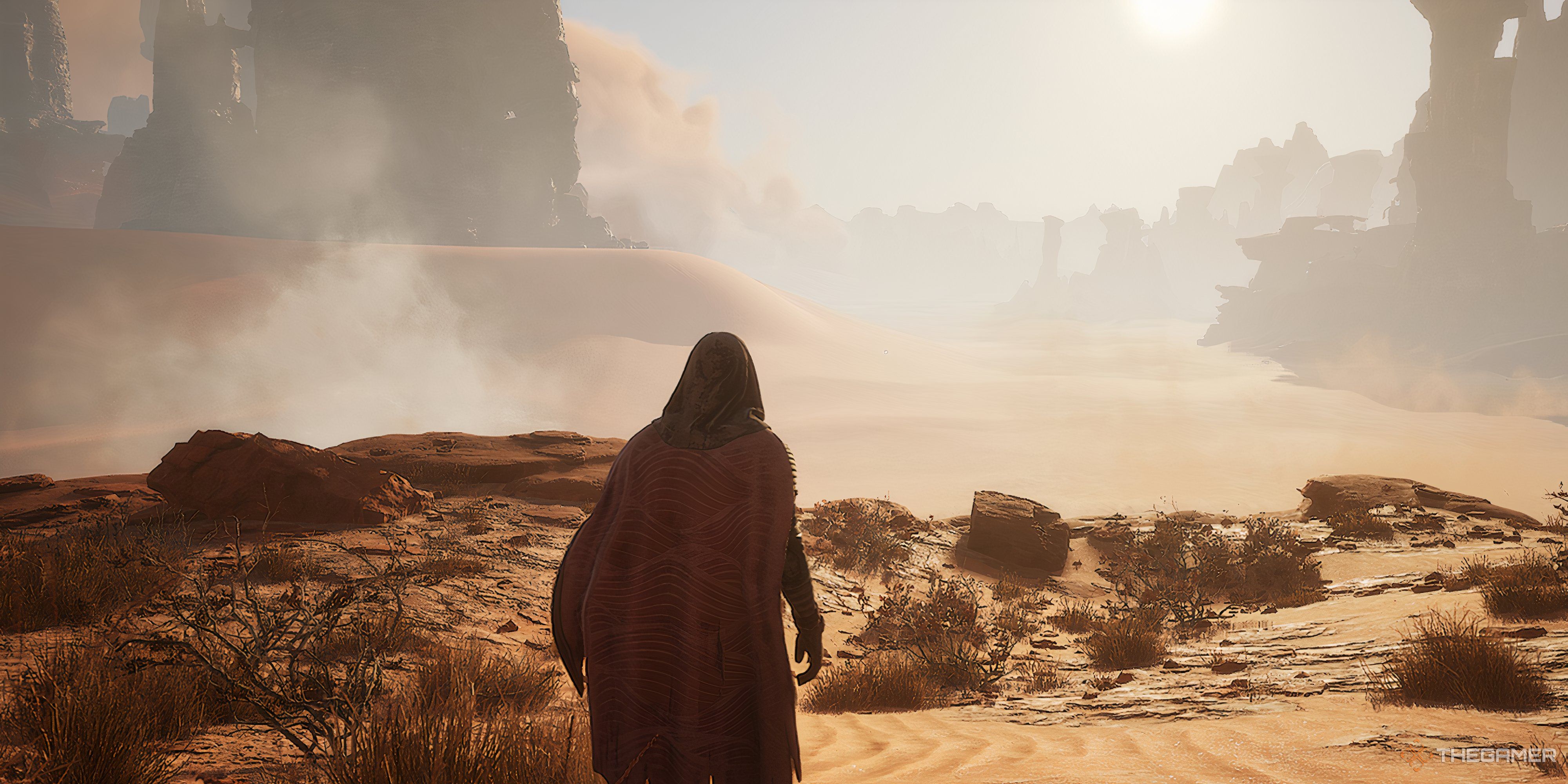 Player looking onward at a large sand basin with a sand storm moving away in Dune: Awakening.