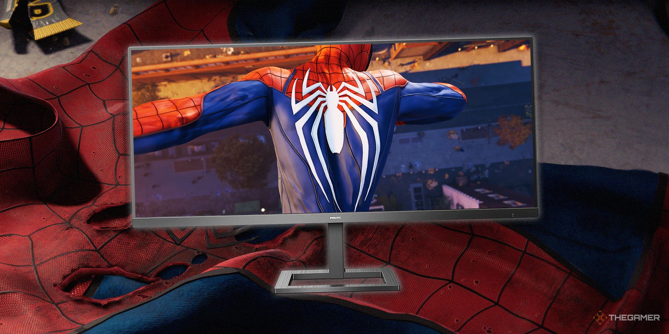 TG Spider-Man suit in ruins with a widescreen monitor showing new suit.