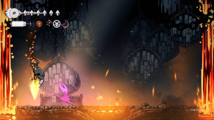 Gron descends on Hornet with a spear plunge attack as she uses a special venomous tool in Hollow Knight: Silksong.