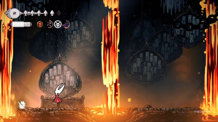 Hornet stands victorious over the Forebrothers Signis & Gron as lava falls from the ceiling in Hollow Knight: Silksong.