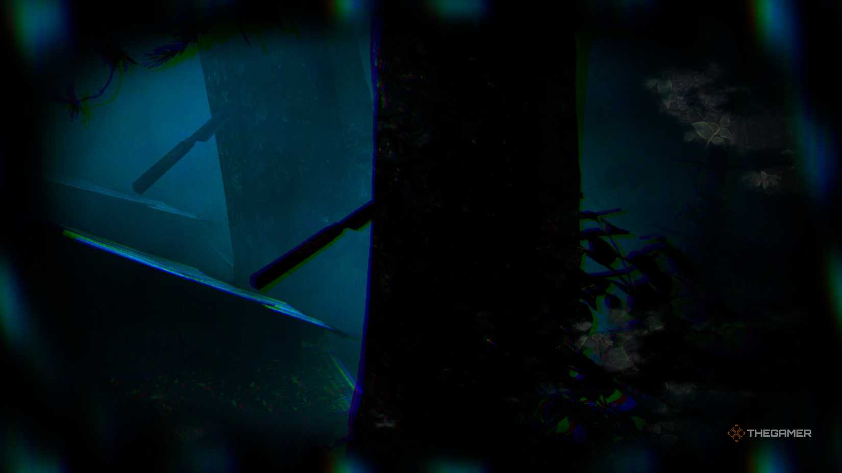 The knife stabbed into a tree in a foggy scene in Silent Hill f.