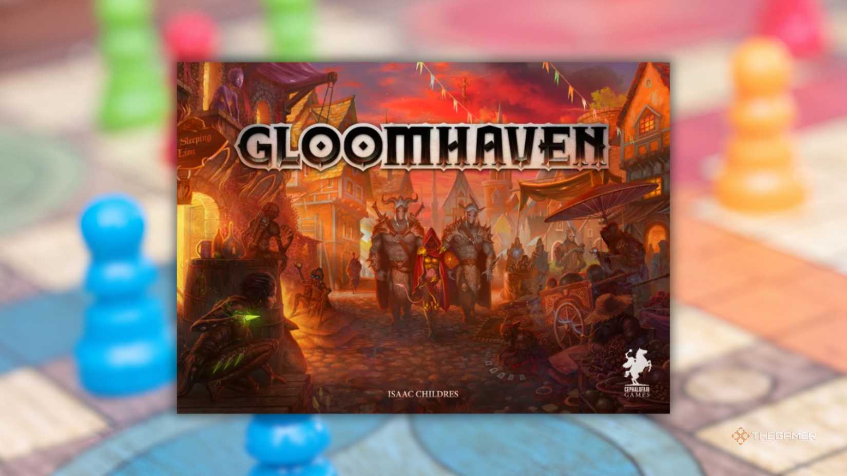 A colorful board game behind Gloomhaven's cover art.
