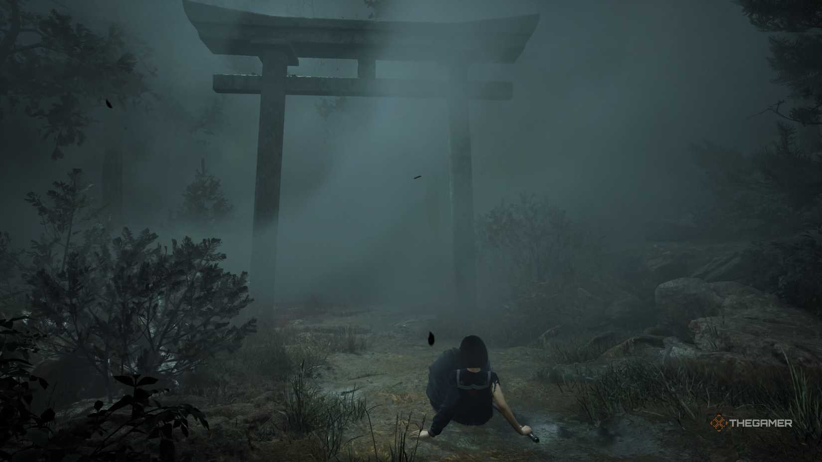 Himiko falls on his knees before a foggy shrine in Silent Hill f. 