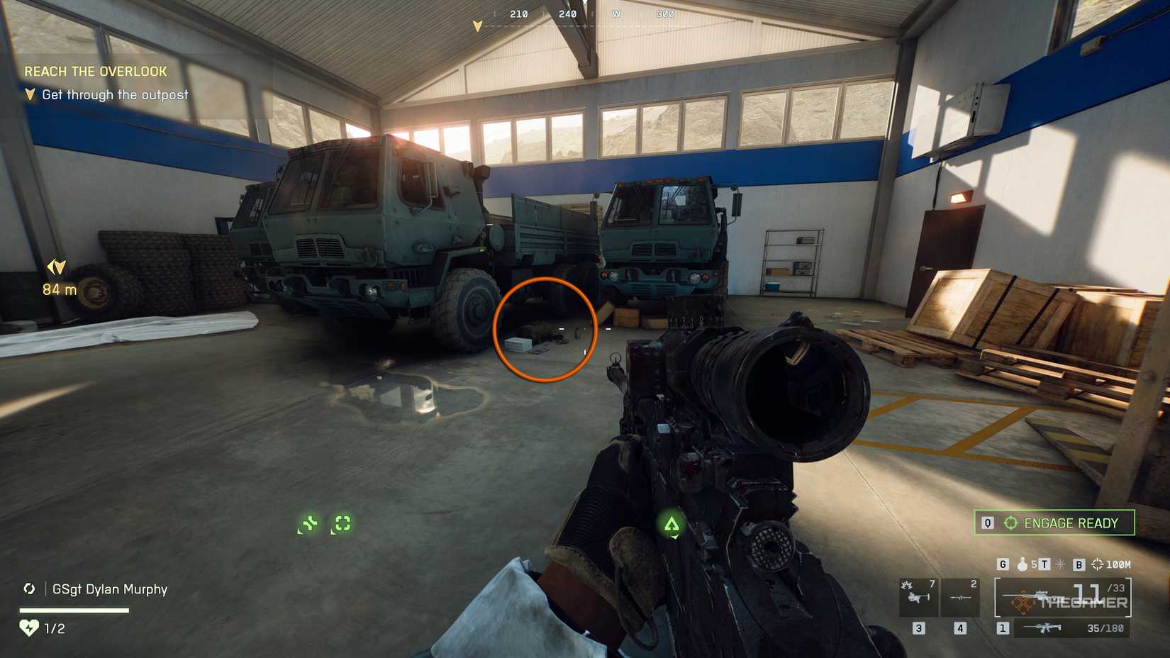 Battlefield 6 player inside the warehouse, looking at two trucks, with an orange circle emphasizing a lot of documents.