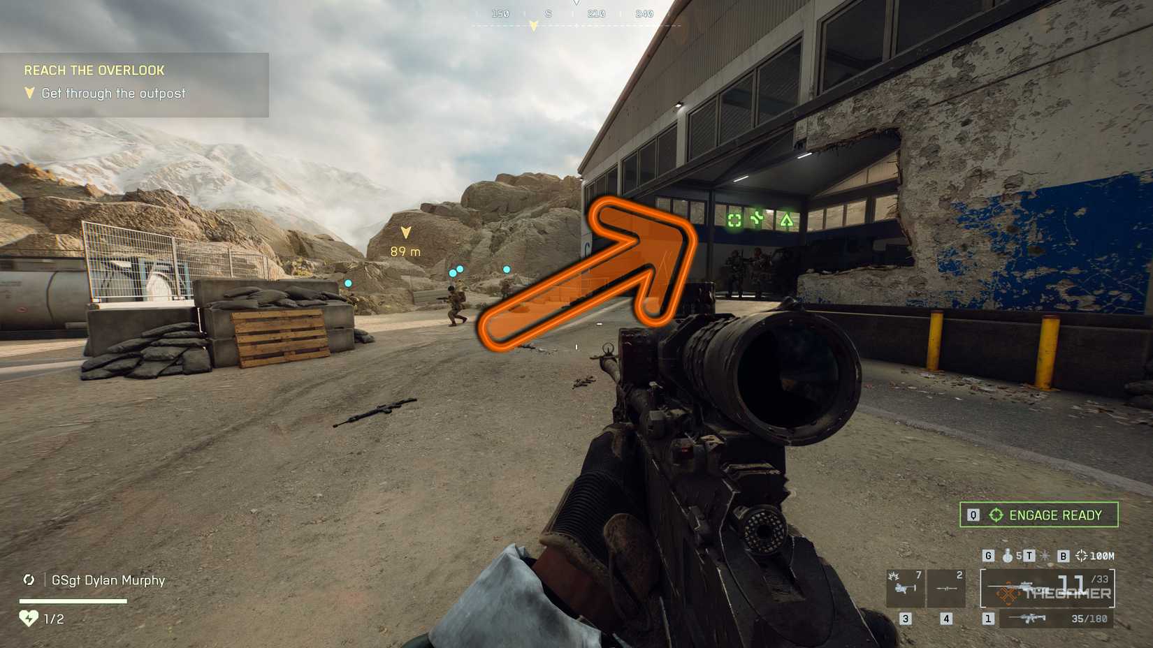 Battlefield 6 standing at the warehouse with an orange arrow pointing inward.