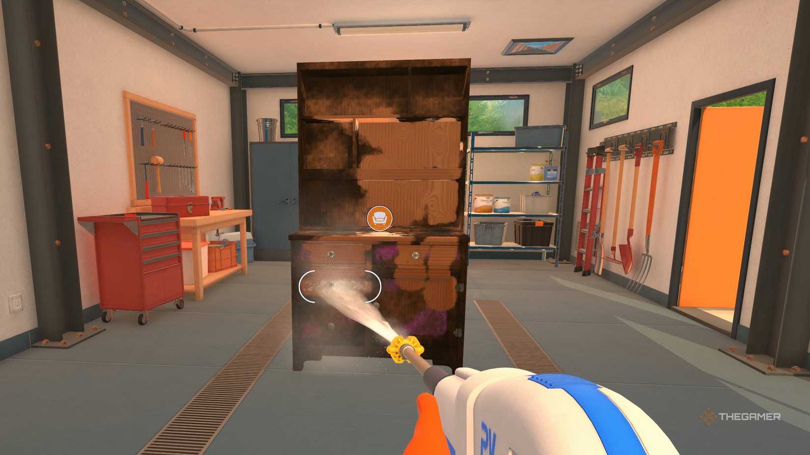 Cleaning the cage in the home base garage in PowerWash Simulator 2.