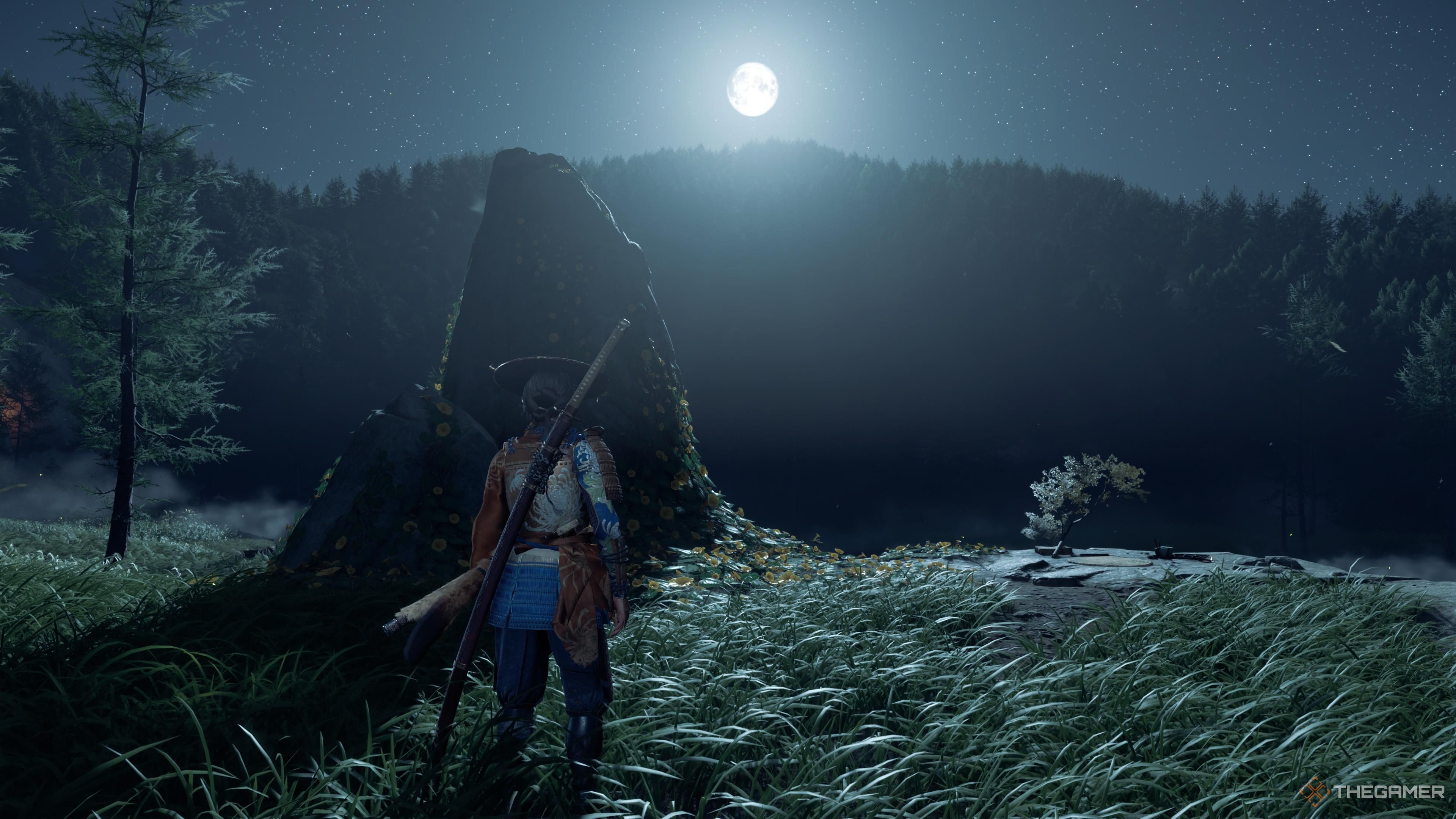 Atsu next to a painting location under moonlight in Ghost of Yotei