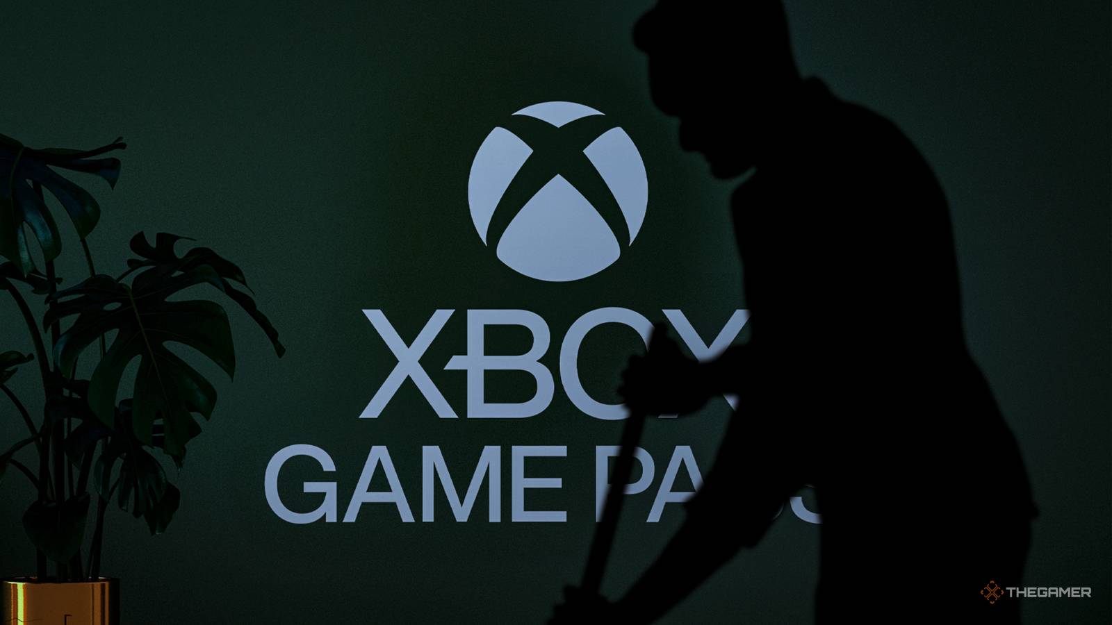NEWS silhouette of a man cleaning in front of an Xbox Game Pass logo on a wall.