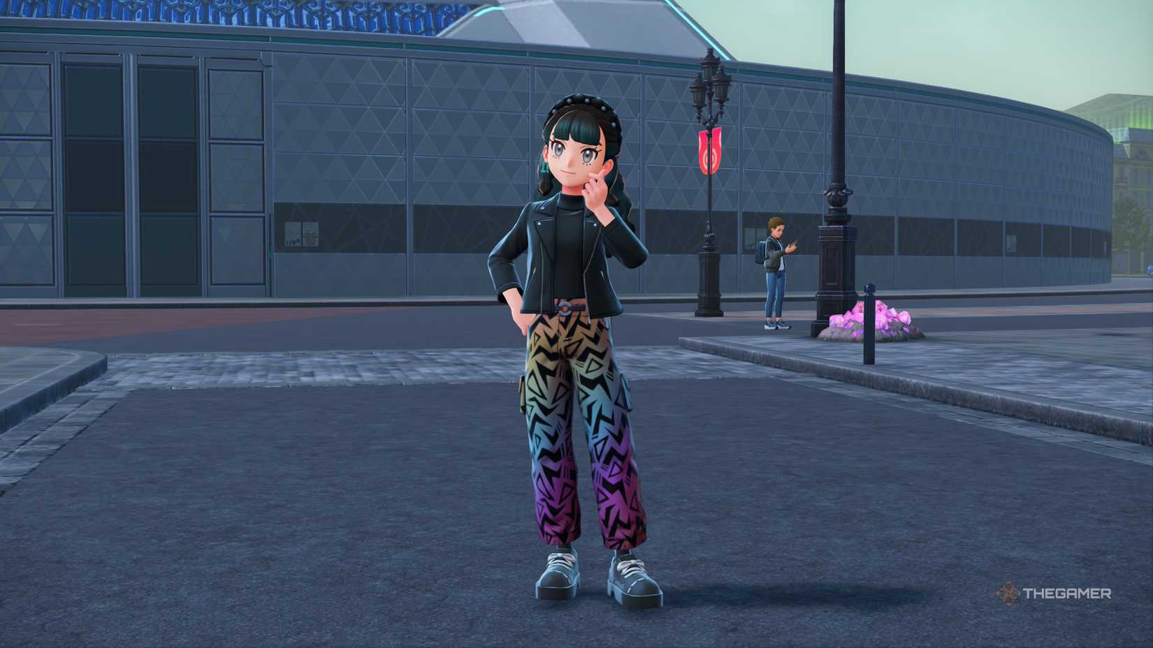 Pokemon trainer posing in a biker jacket and rainbow trousers in Pokemon Legends Z-A.