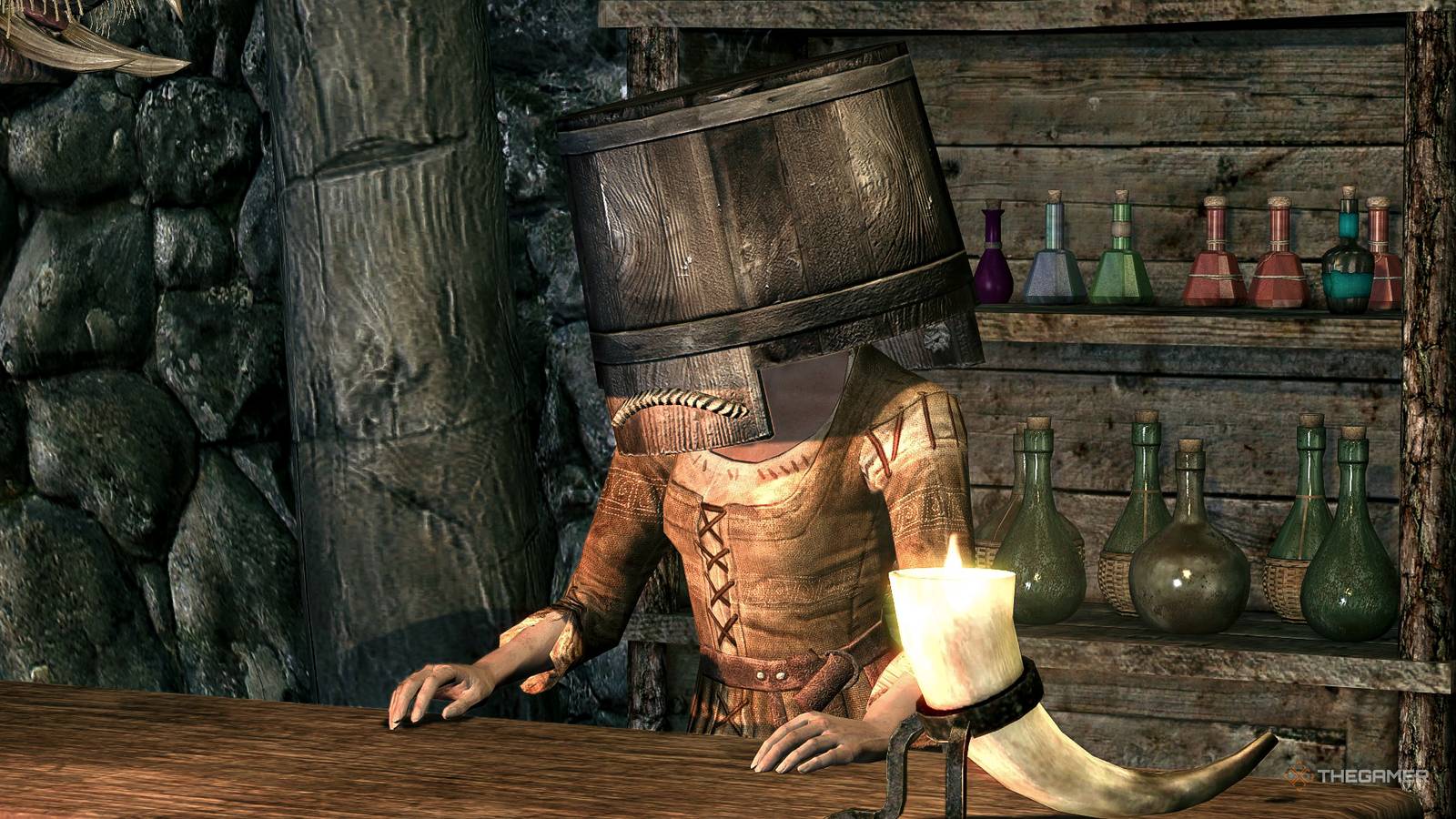Skyrim alchemy merchant with a bucket on her head.