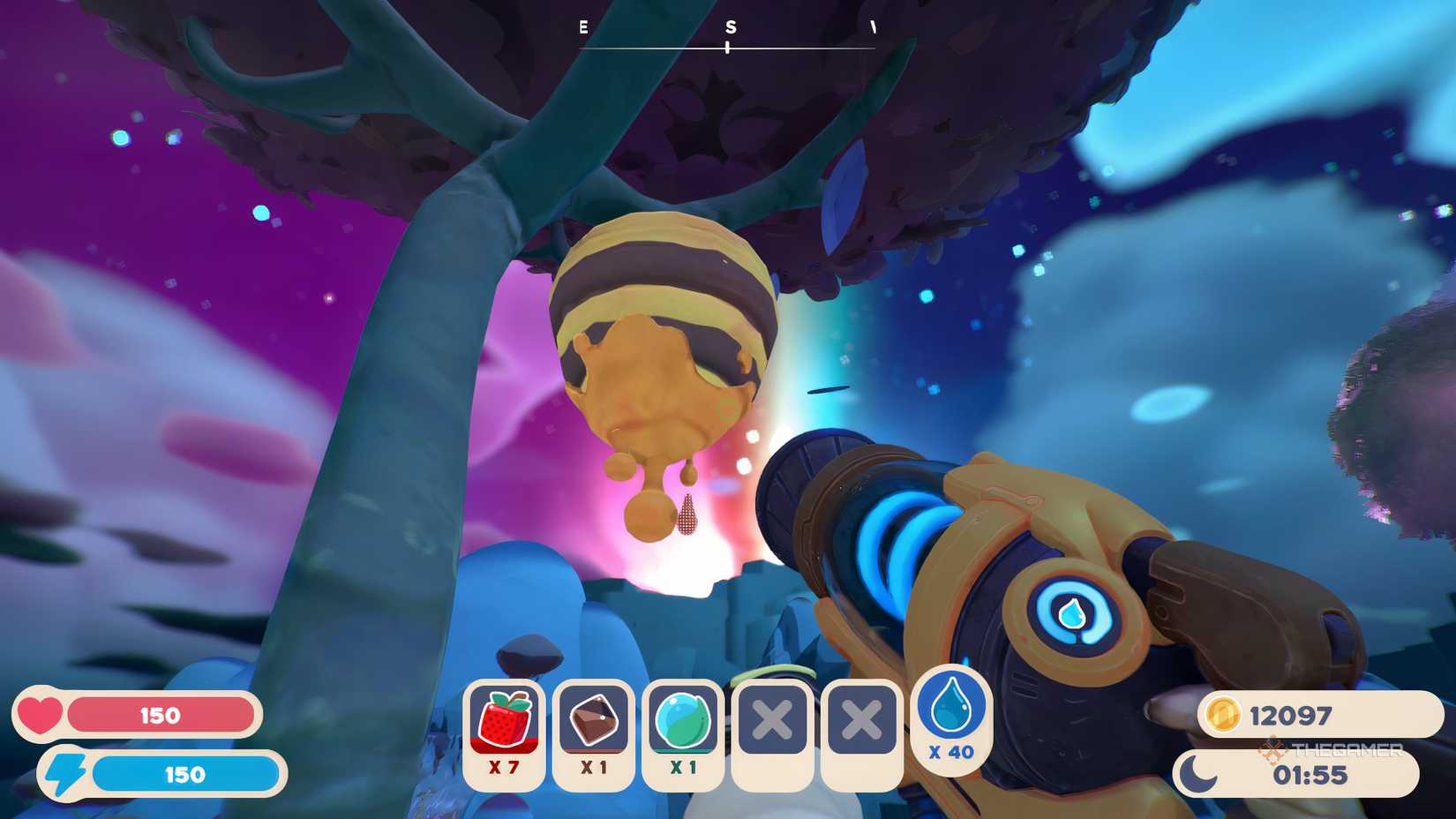 A striped hive hanging from a tree.