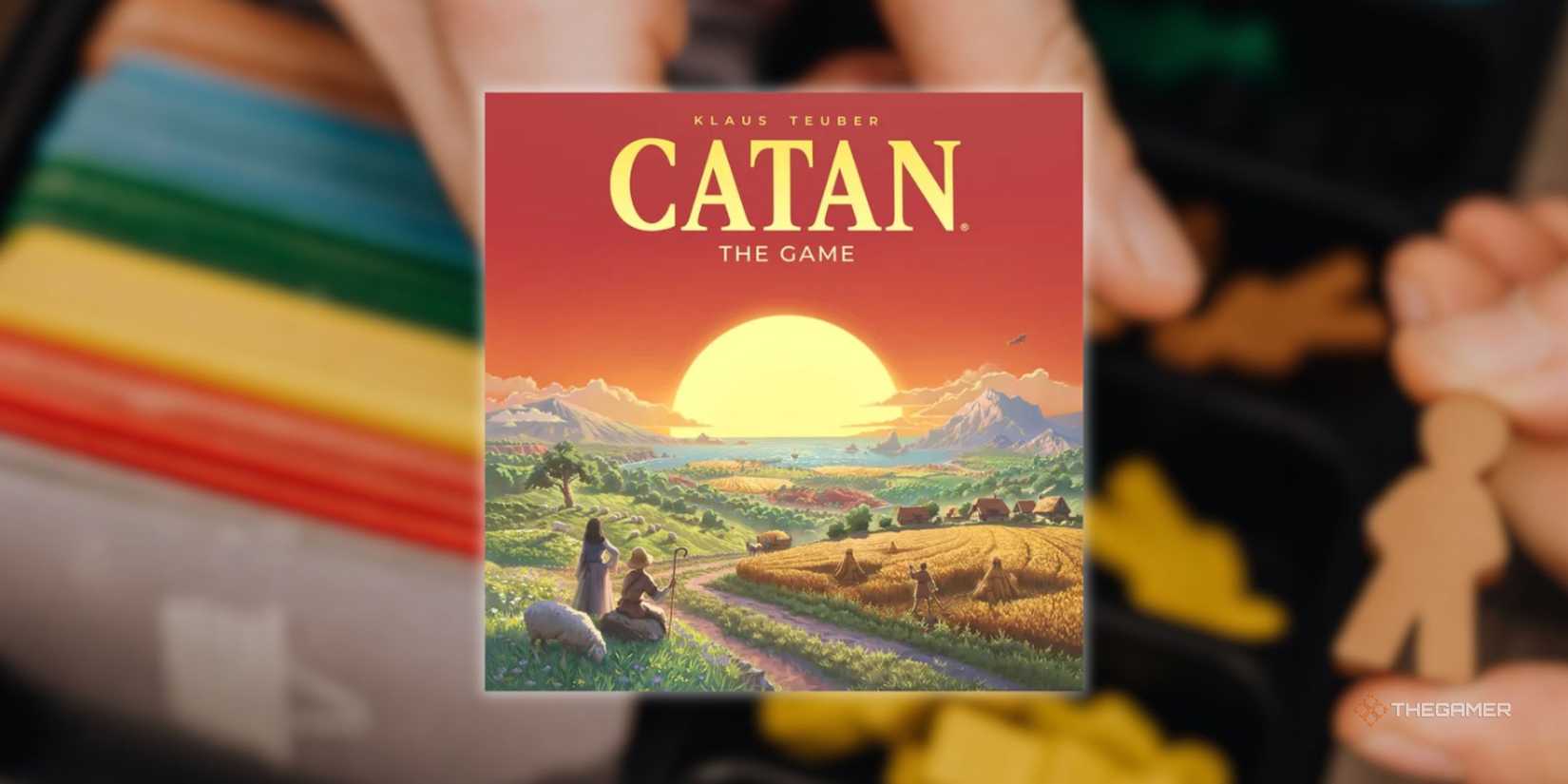 A Catan sign in front of a blurry image of someone preparing to play a board game.