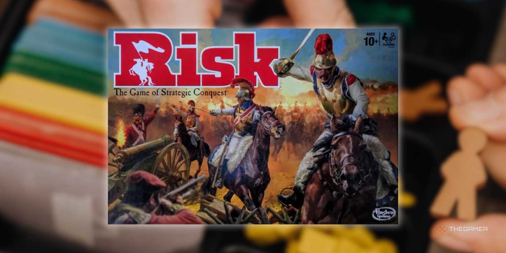 A Risk sign in front of a blurry image of someone preparing to play a board game.
