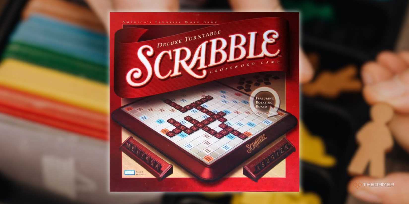 A Scrabble sign in front of a blurry image of someone preparing to play a board game.