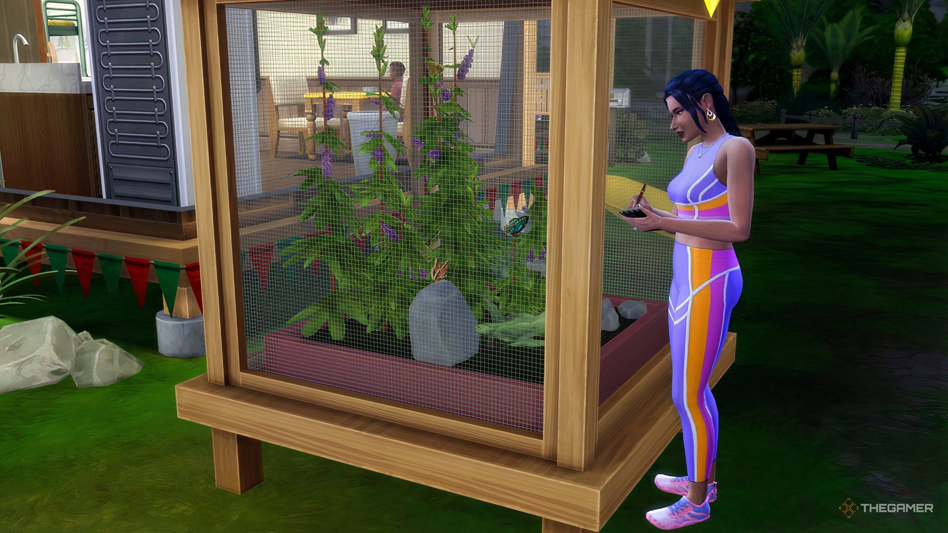 The Sims 4 Sim butterflies in a cage.