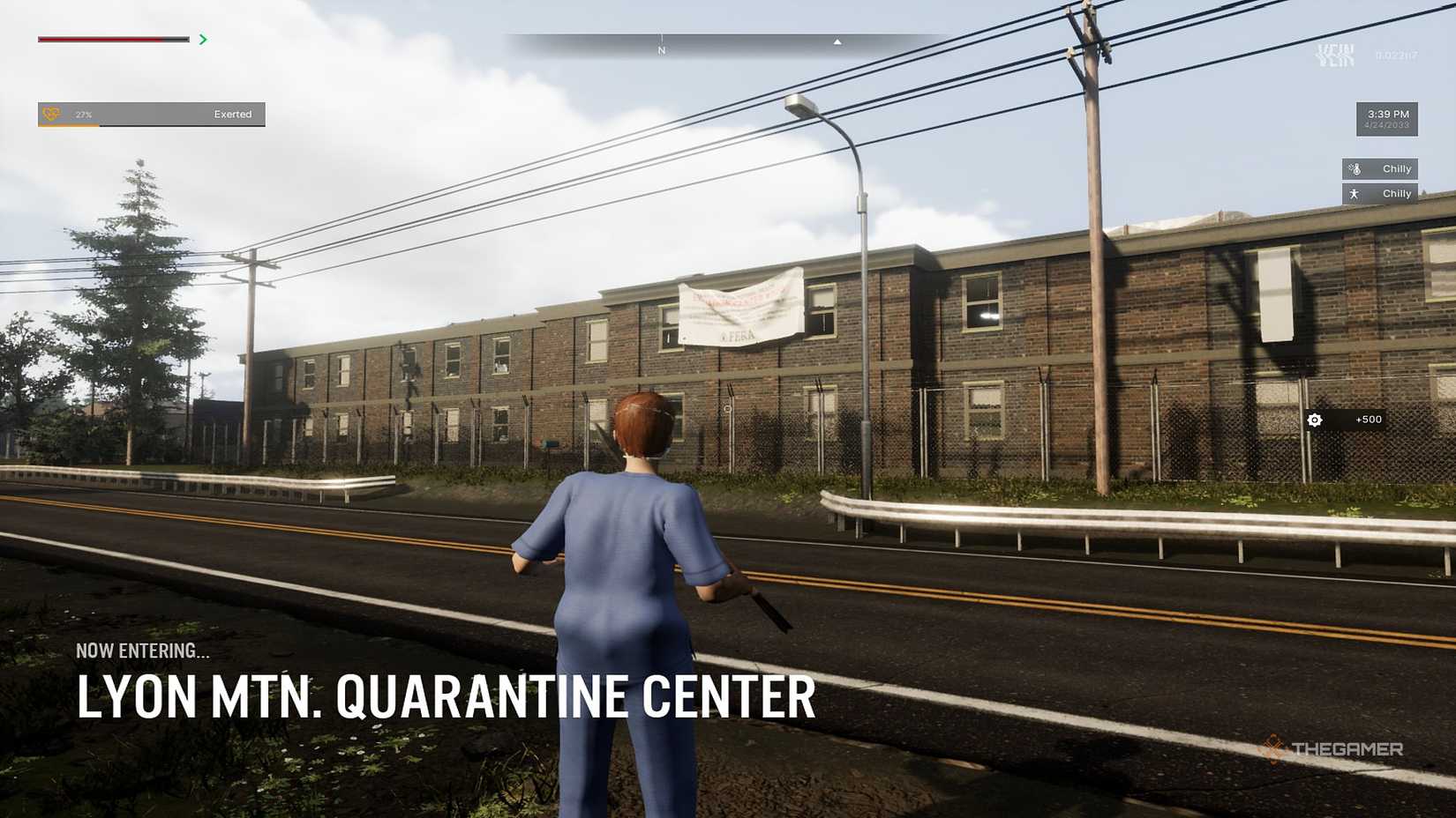 A figure in medical scrubs stood outside the quarantine area in Vein.