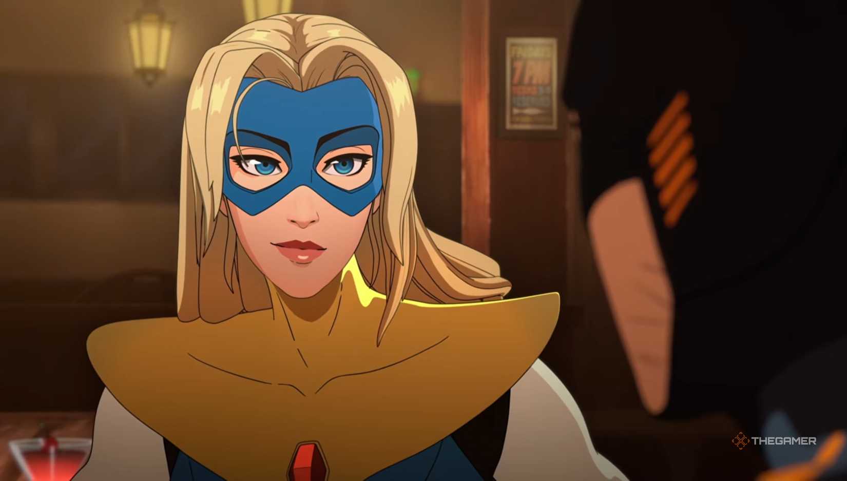Blonde Blazer smirking in a bar in Dispatch.