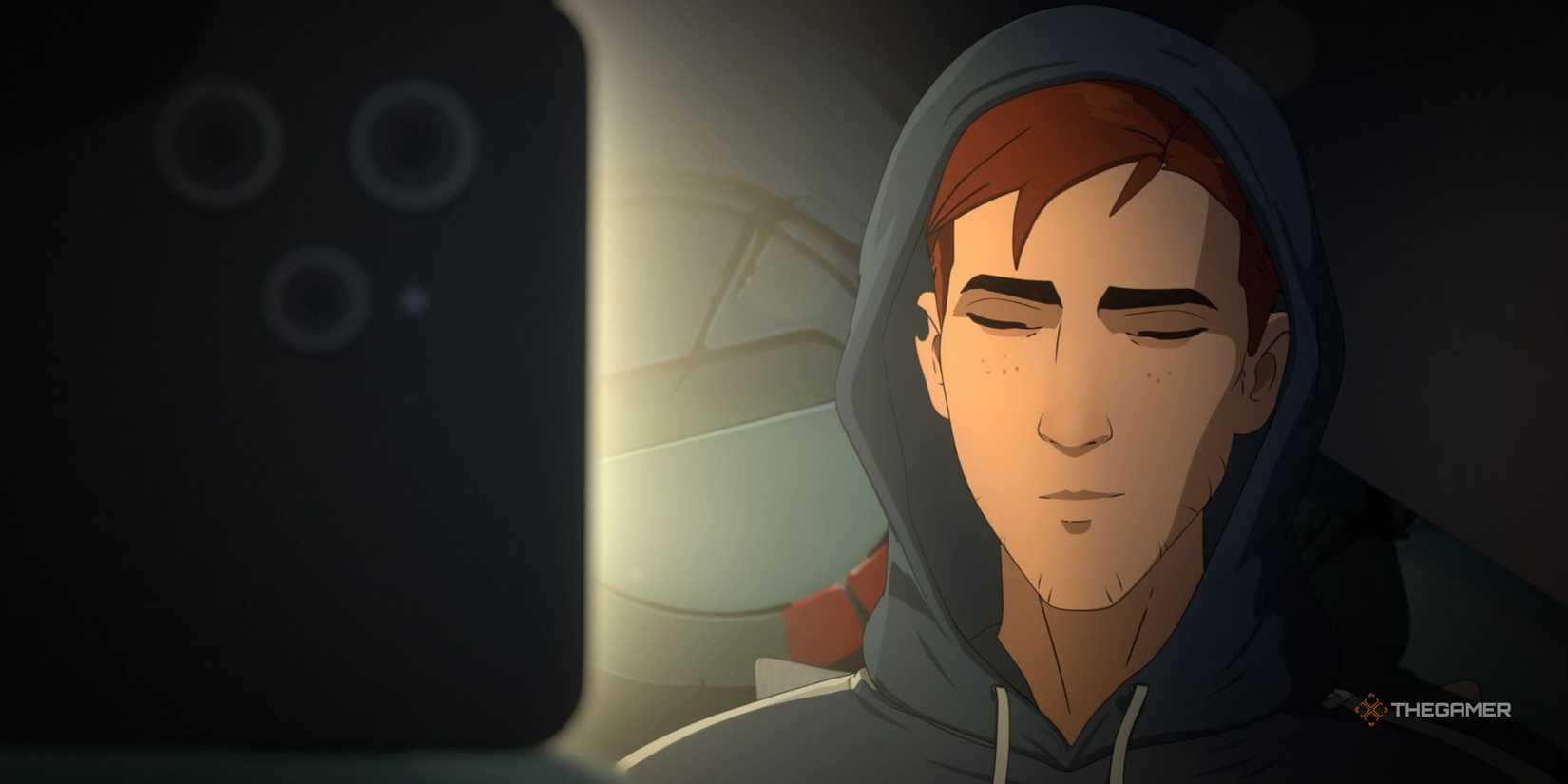 Robert smiling at his phone in Dispatch.