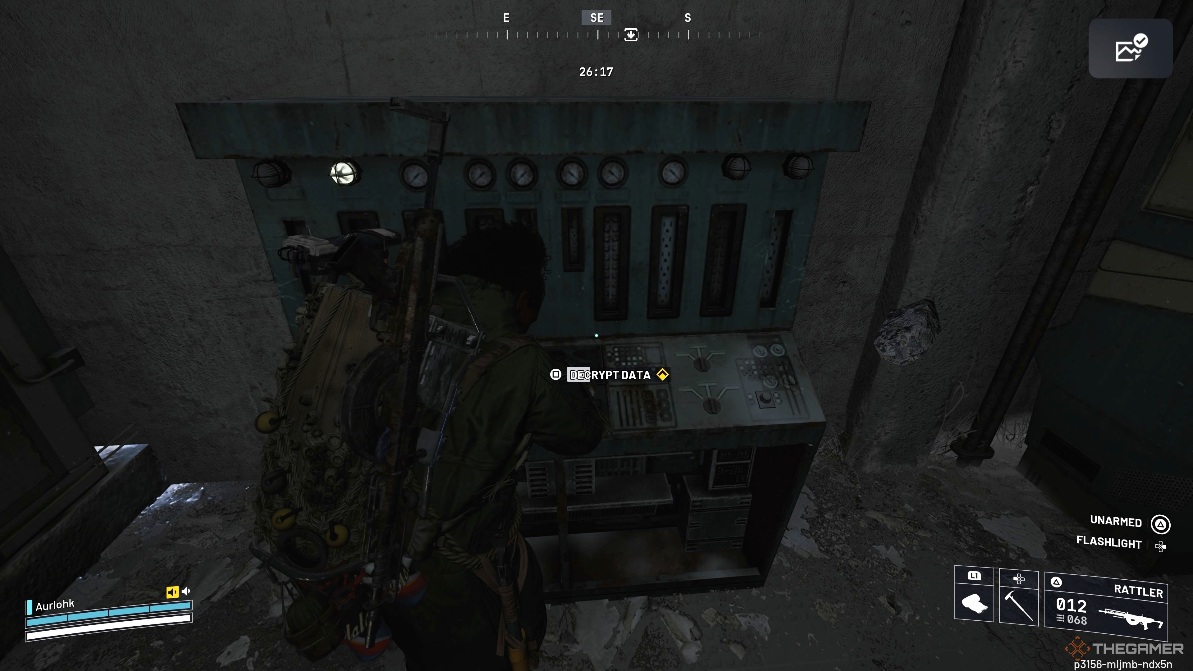 Player raider interacting and using an old console to try and decrypt some data in Arc Raiders.