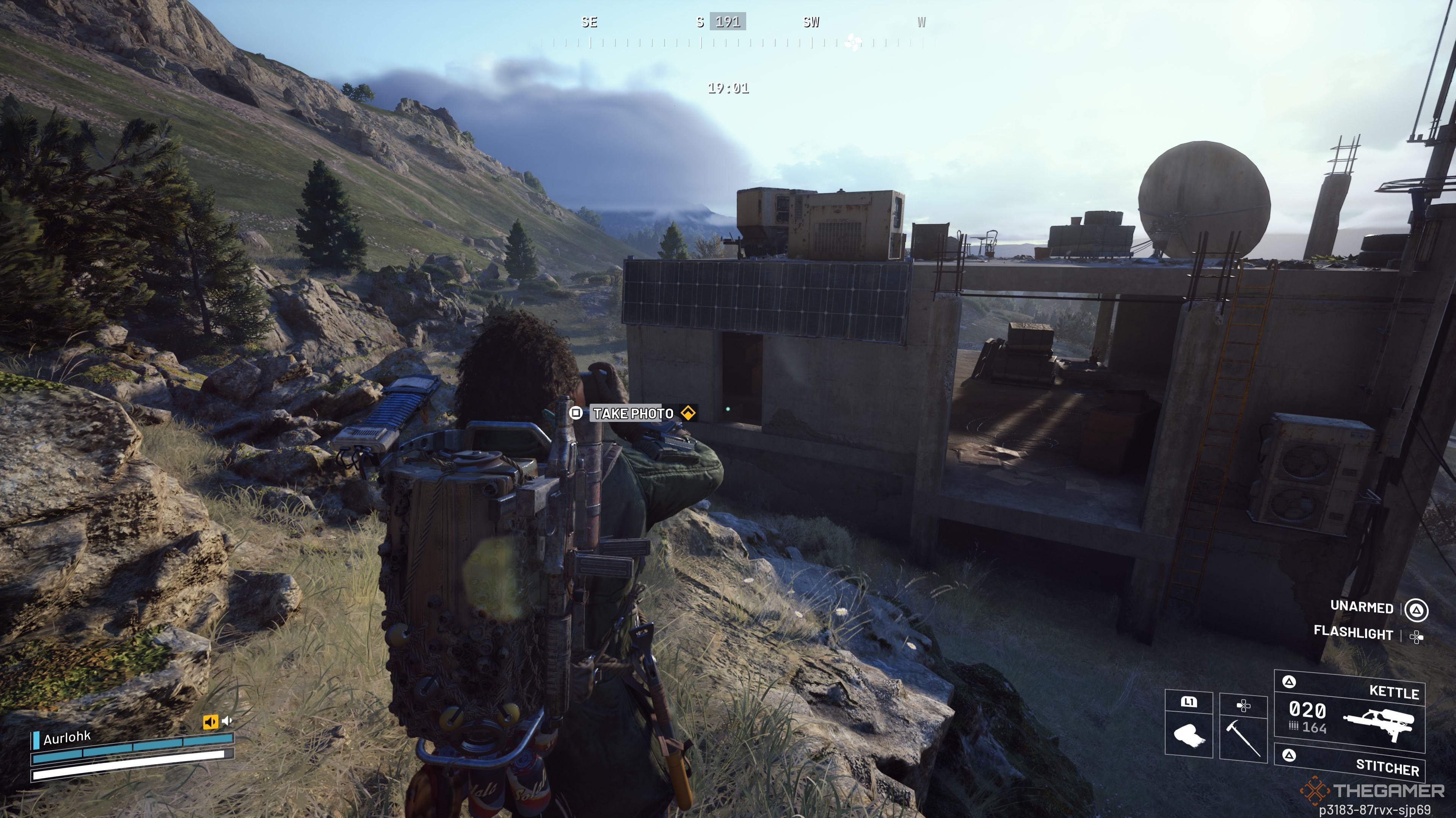 Player raider taking photos of an a house from an abandoned housing project at The Blue Gate in Arc Raiders.