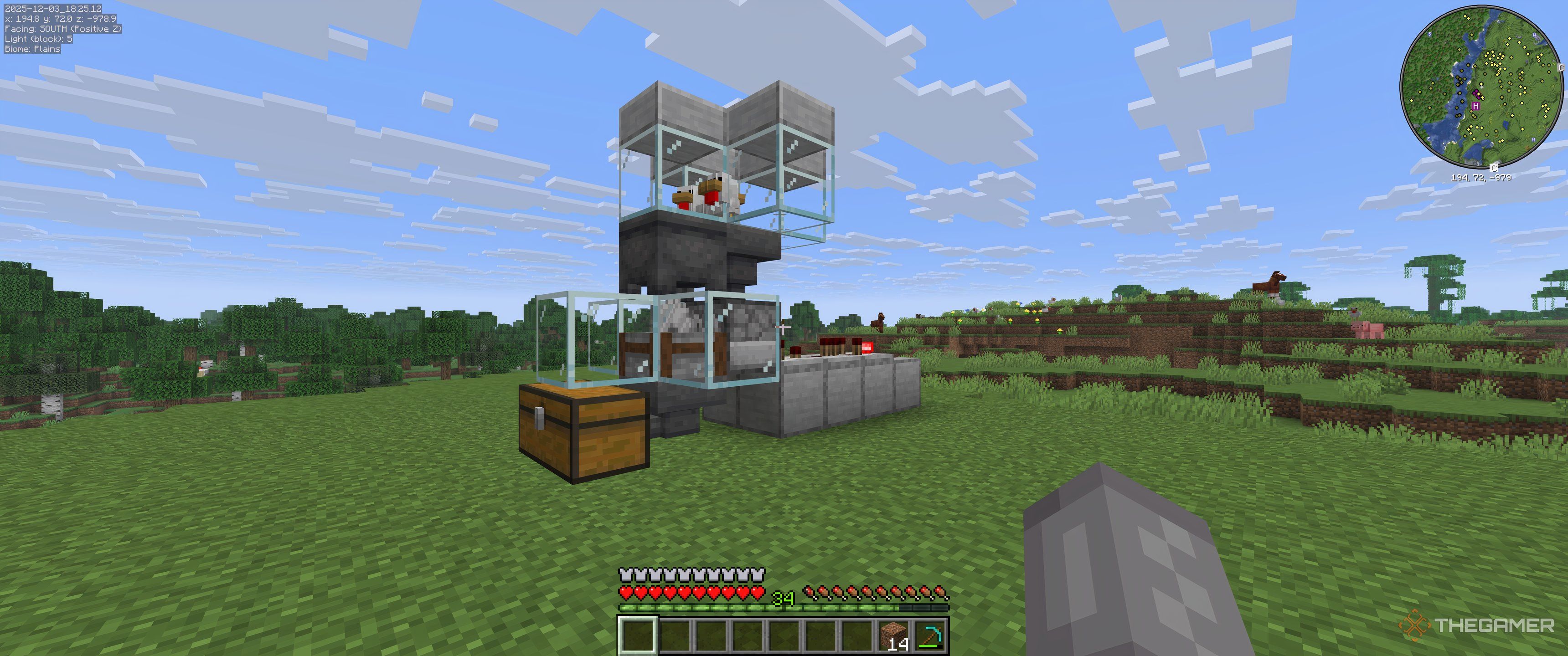 Fully completed simple auto chicken farm with chickens inside in Minecraft.