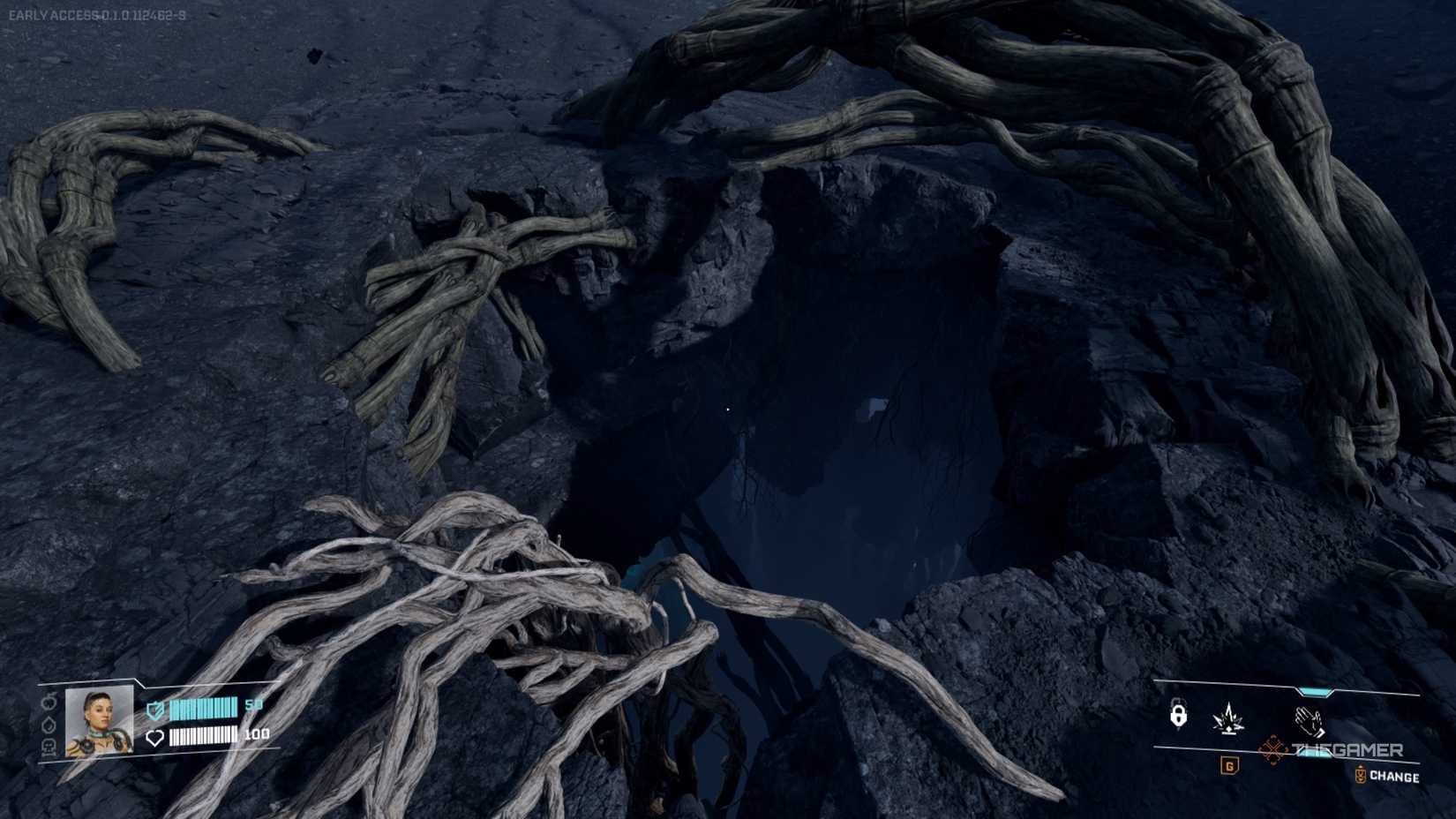 An open hole with vines in the dark in StarRupture.