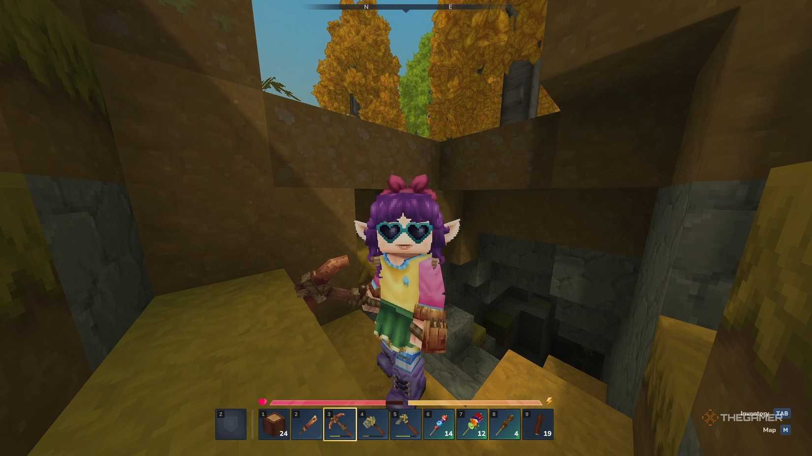 Hiding at the entrance to a cave in Hytale.
