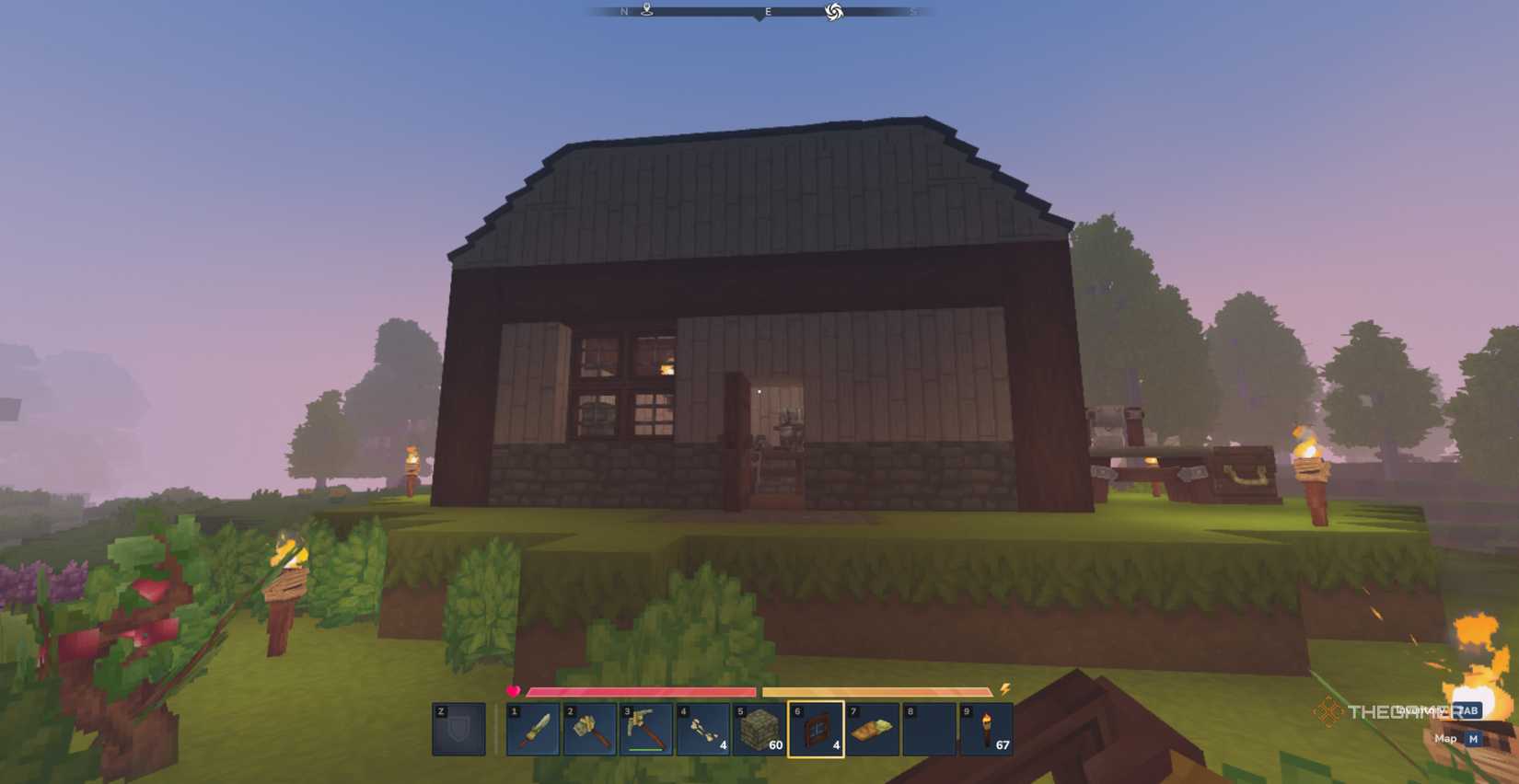 Player character standing outside a small starter house with a window and a Builder's Workbench nearby in Hytale.