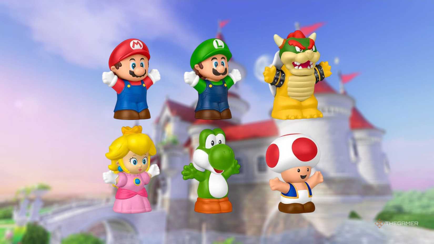 my mario little people figures in front of the peach castle.