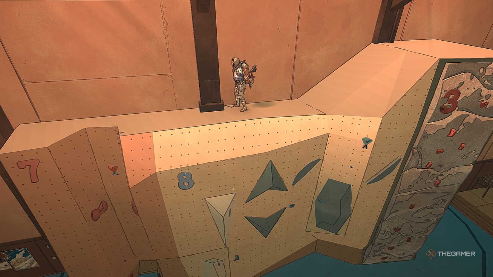 Aava at the top of climbing wall eight in Cairn.