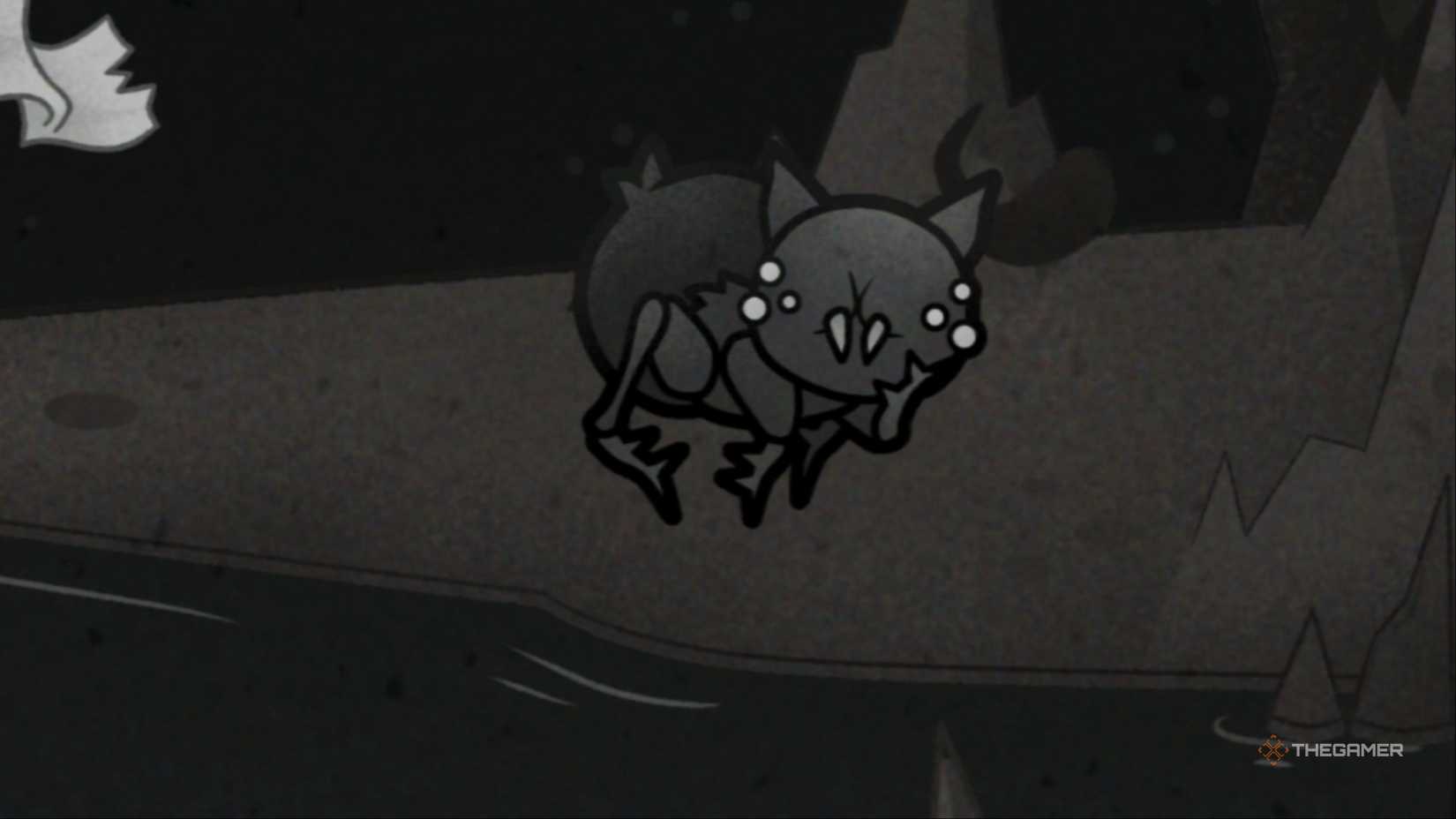 A close-up of One Baby Spider, a dark black Spider Kitten who looks innocent and strangely adorable in Mewgenics.