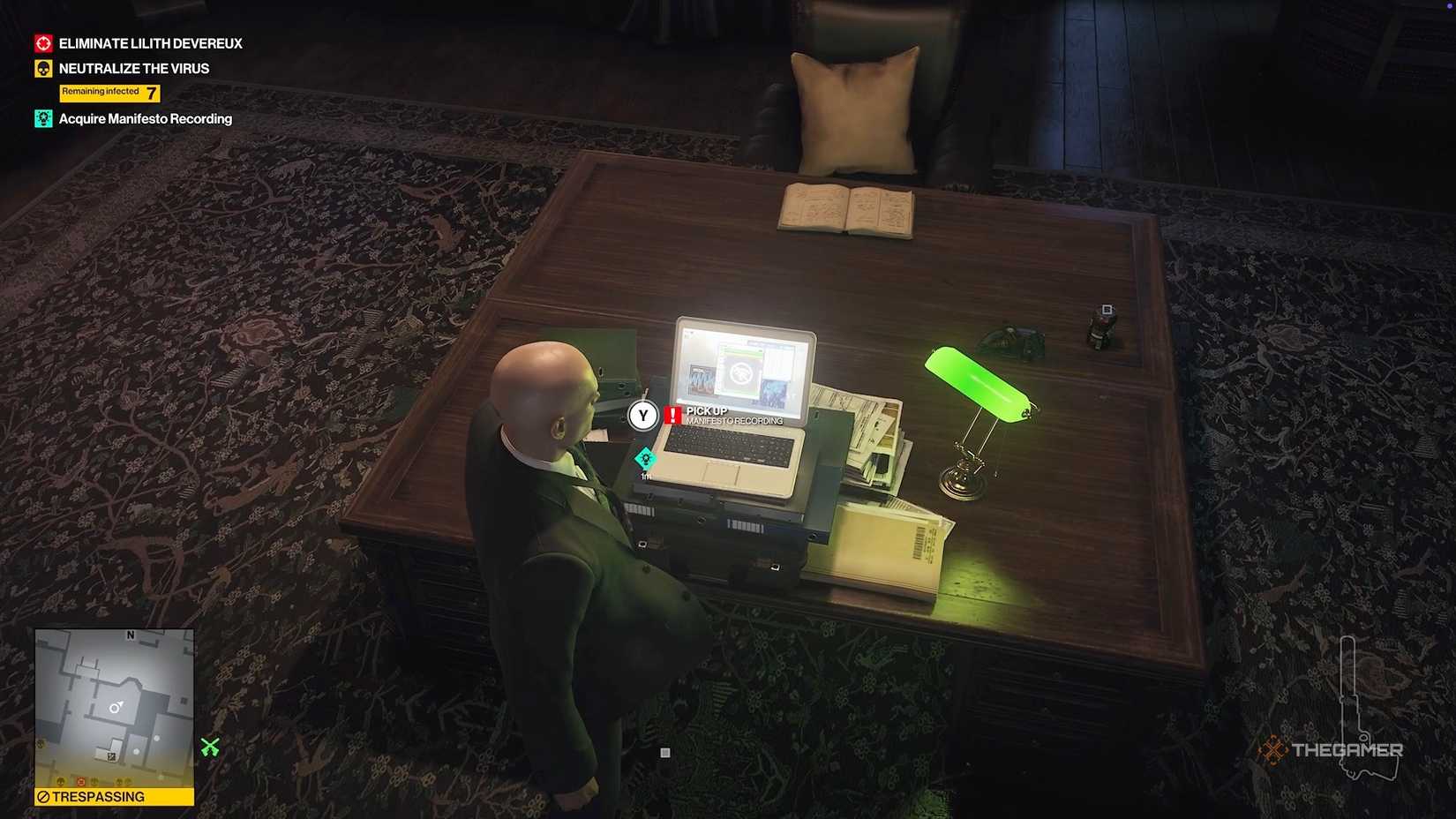 Agent 47 acquiring data from a computer in Hitman World of Assassination.