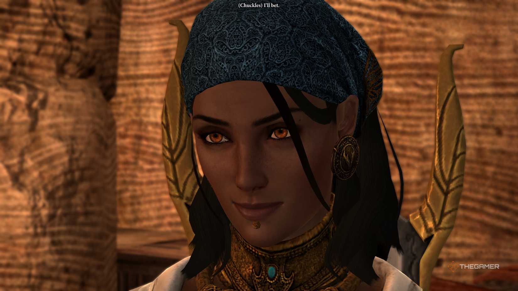 Isabela in Dragon Age 2. She is a woman with dark skin and black hair, wearing gold jewelry. 