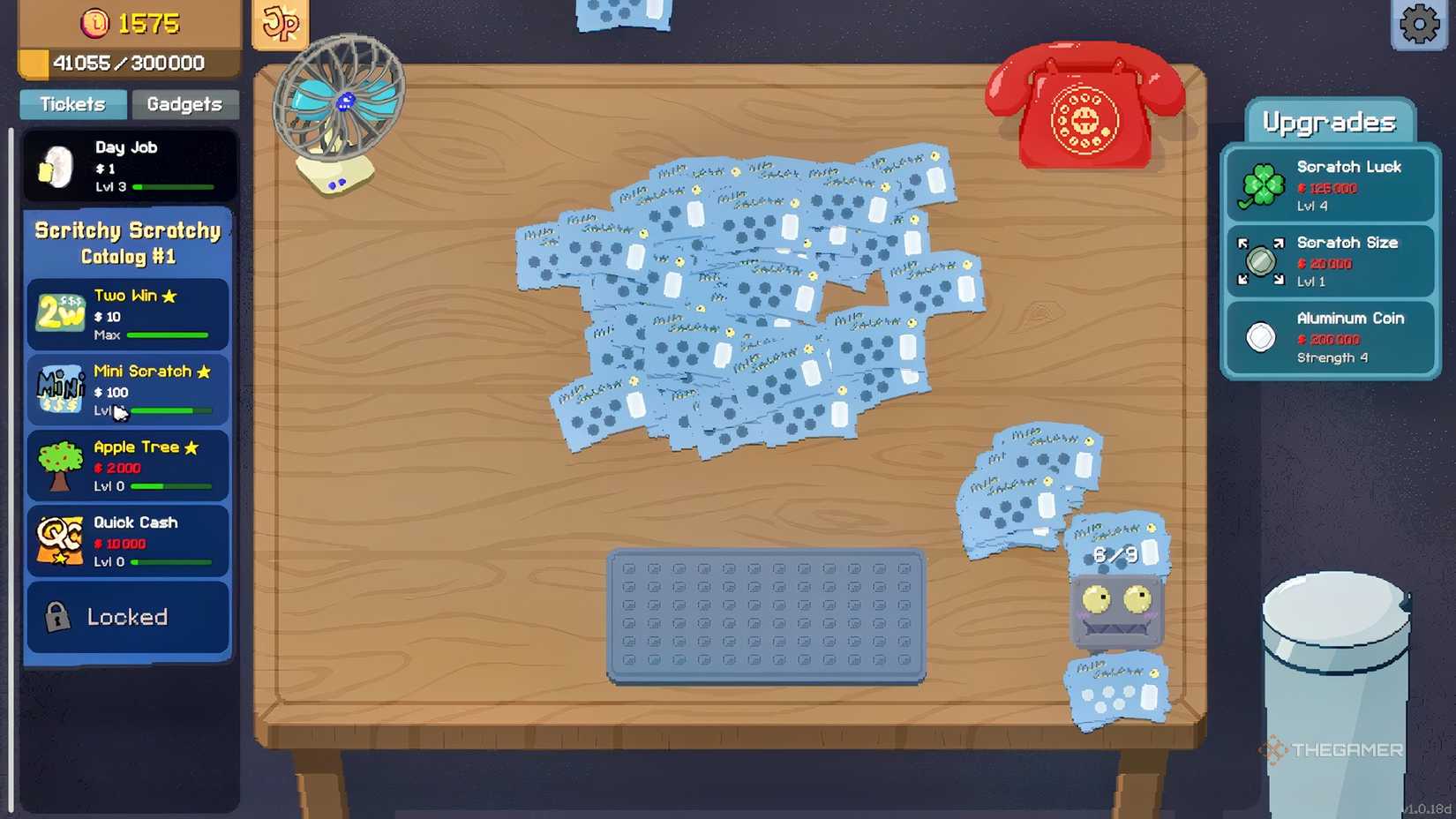 Scritchy Scratchy cards on the table with a lot of gadgets.