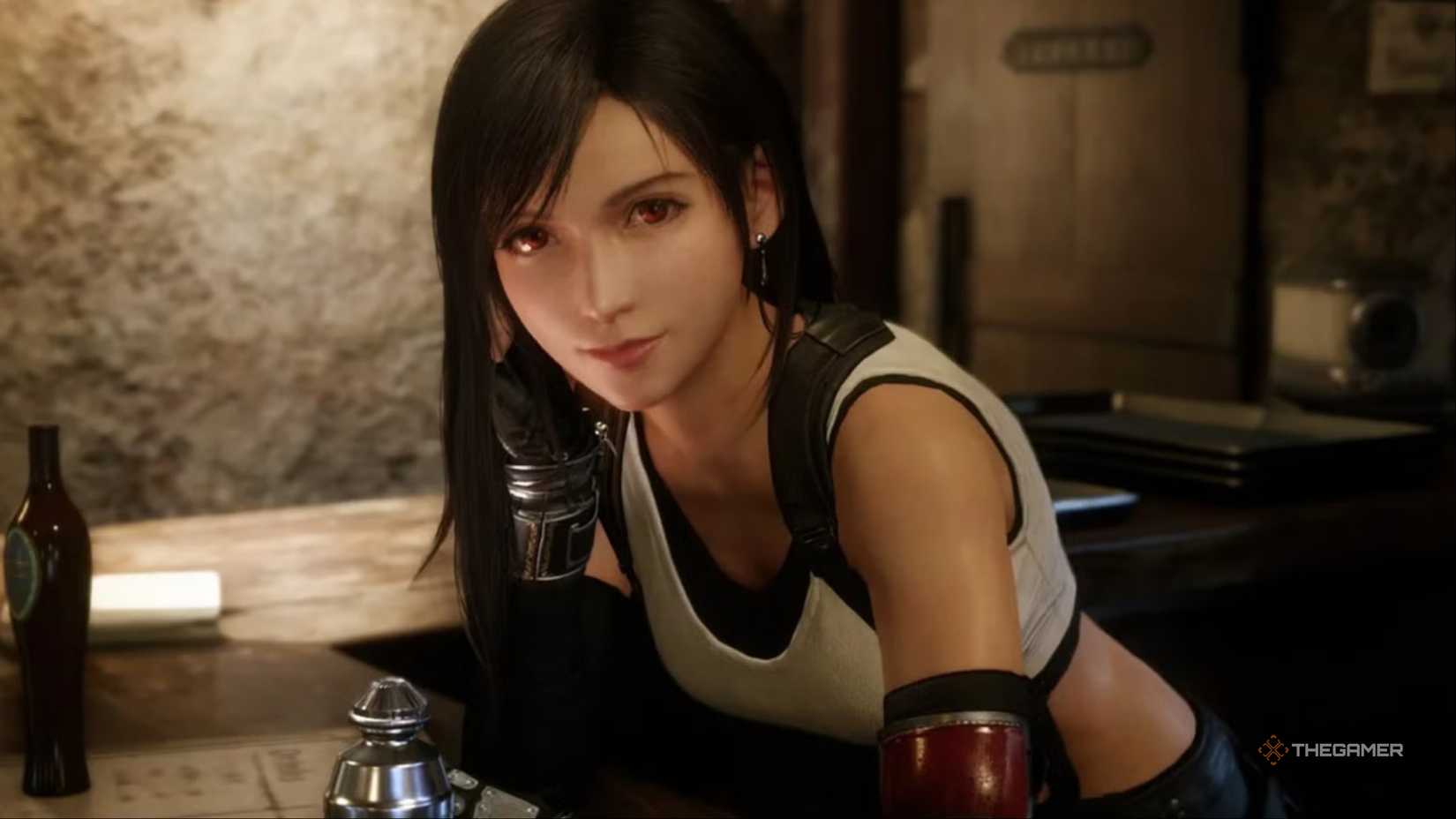 Tifa leans against the pole in Seventh Heaven in Sector 7 Slums in Final Fantasy 7 Remake.