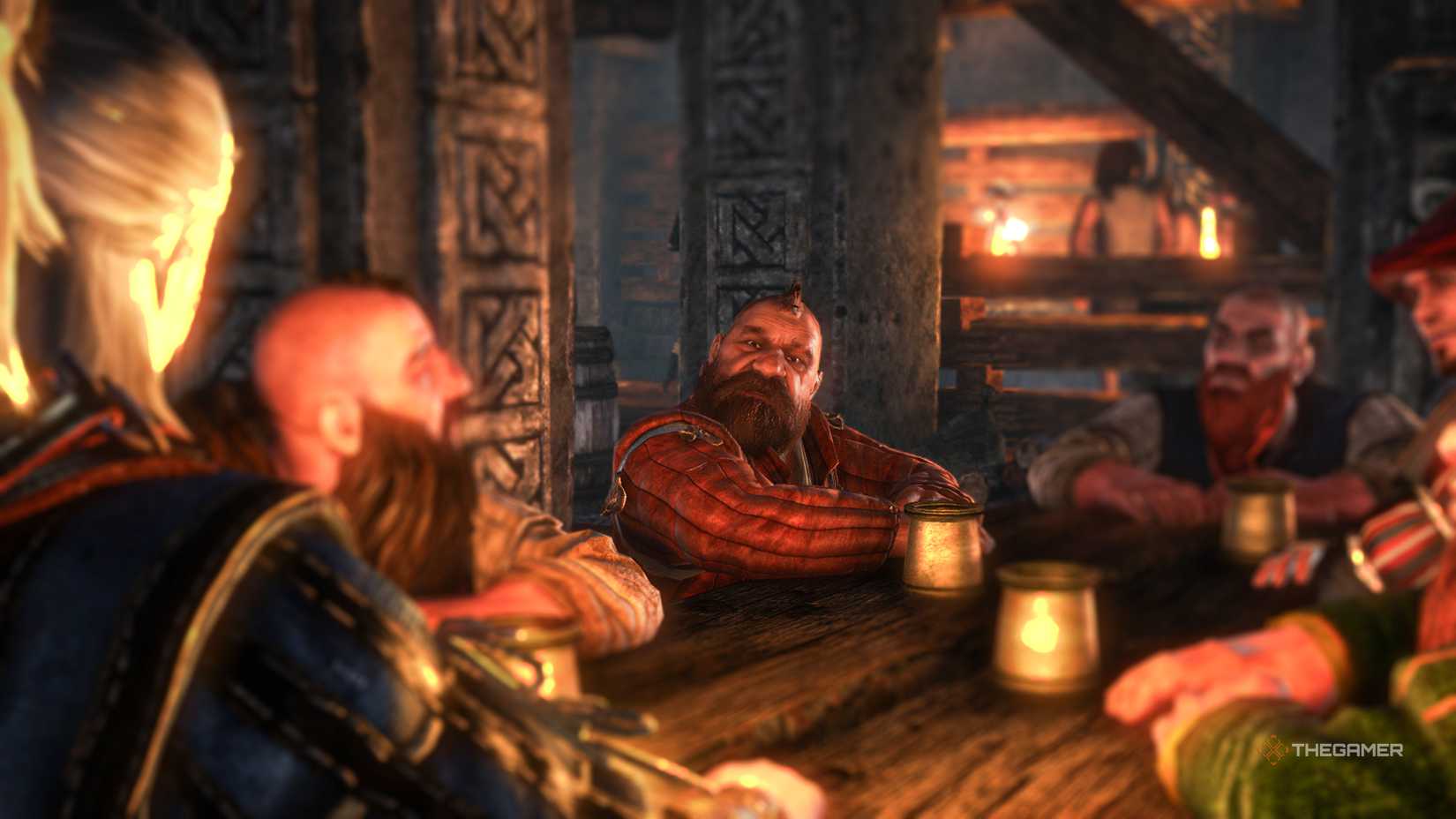 Zoltan from The Witcher 2 sits at the table with Geralt.