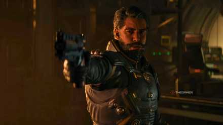 Arjun points a gun at someone off-screen in Saros.